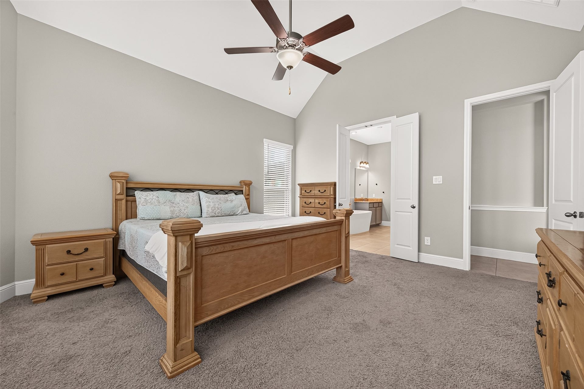 Primary retreat is large and has plenty of space for a sitting room looking out to the back yard.