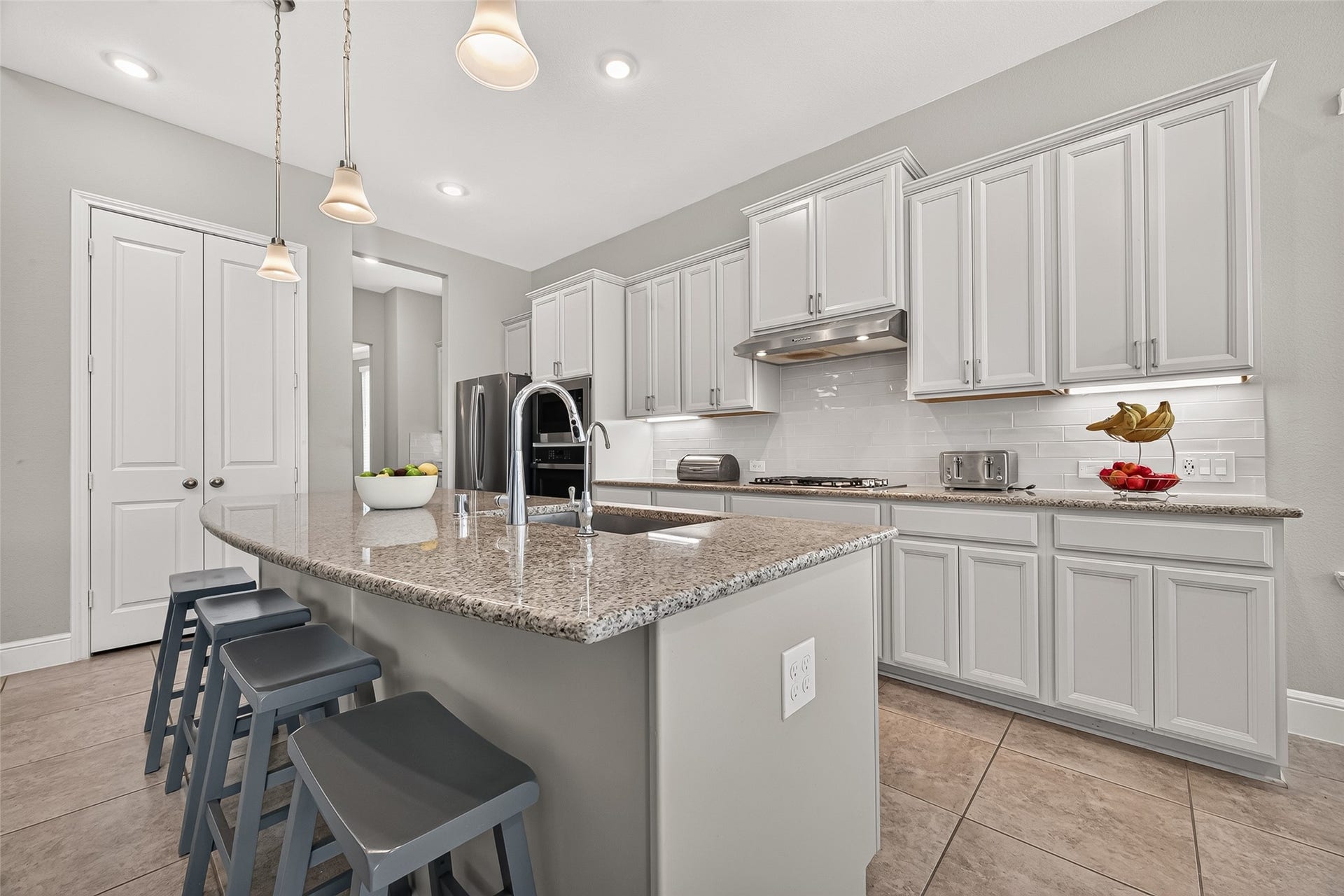 Kitchen offers under counter lighting and pantry space.