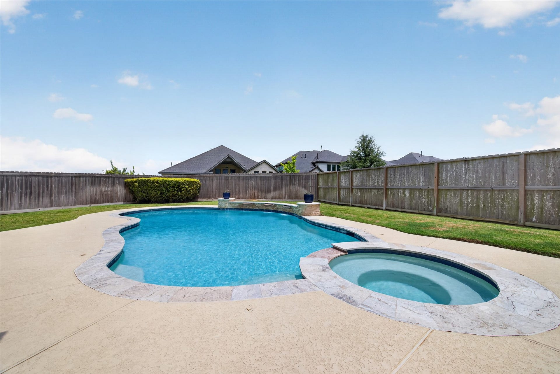 View of the pool and hot tub.