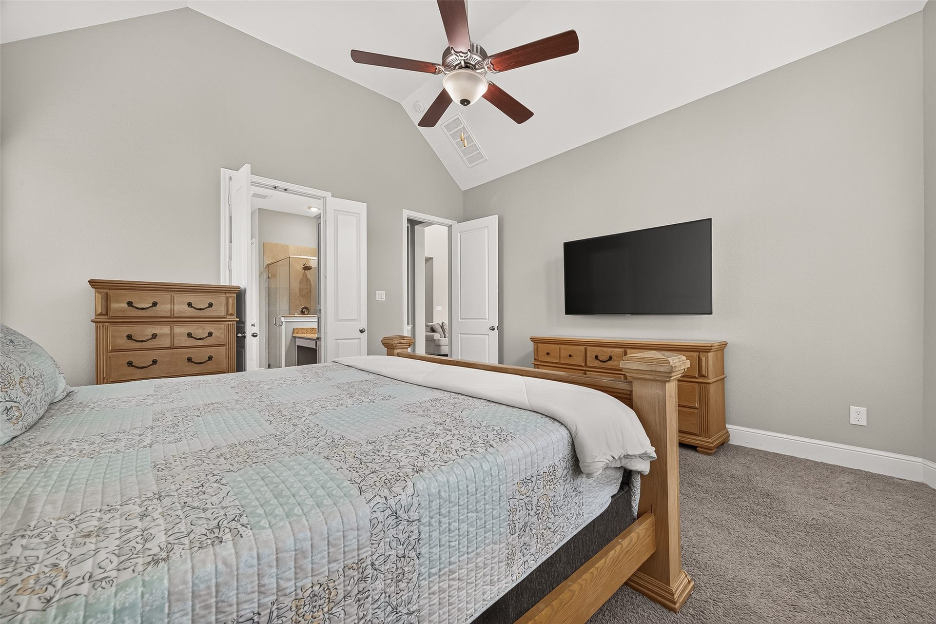High ceilings are a great touch in the primary bedroom.