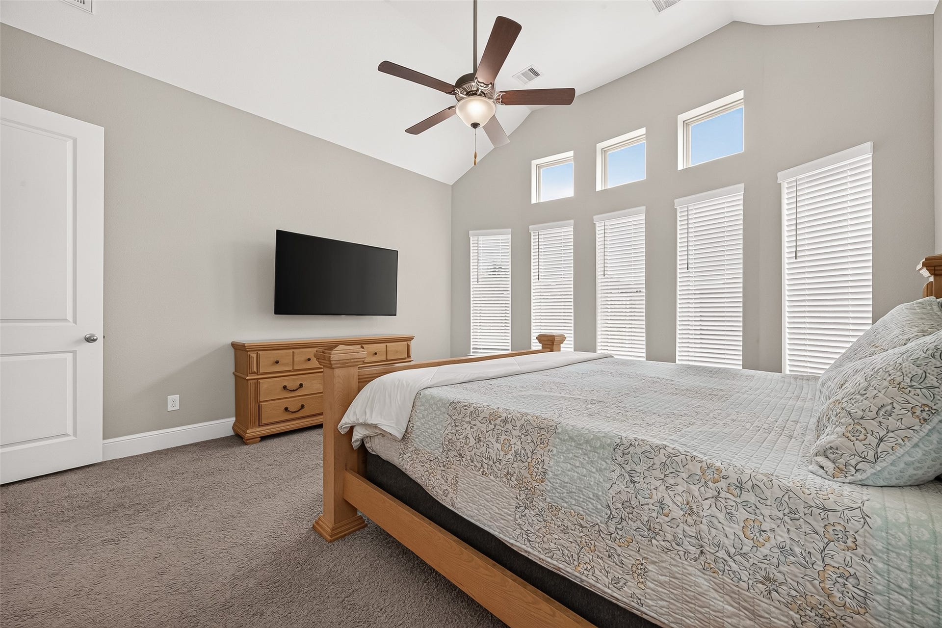 Primary bedroom also has large windows across the back.