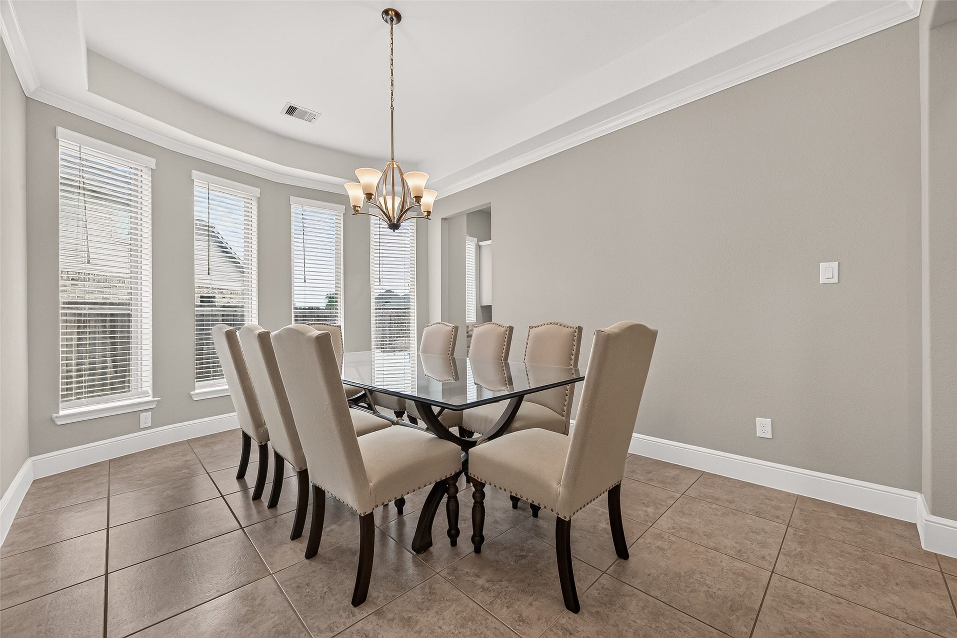 Large dining room with wall of windows. This is a great size space.