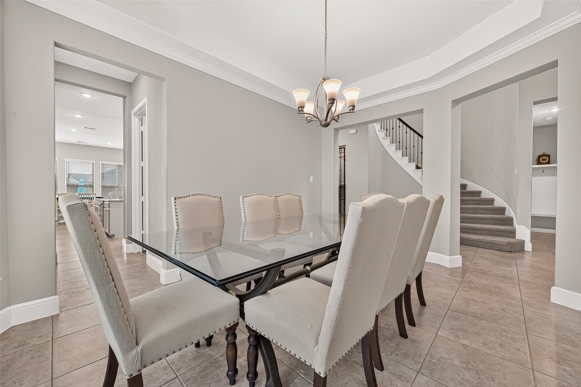 Anther view of the dining room where you can see the stairs and mud room.