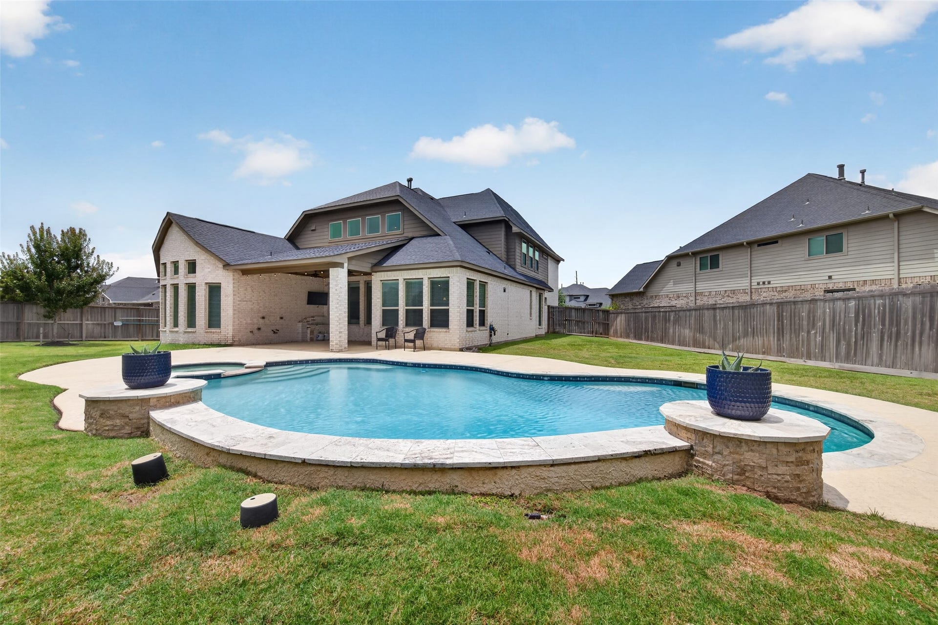 Even with a pool there is ample yard space on both sides.