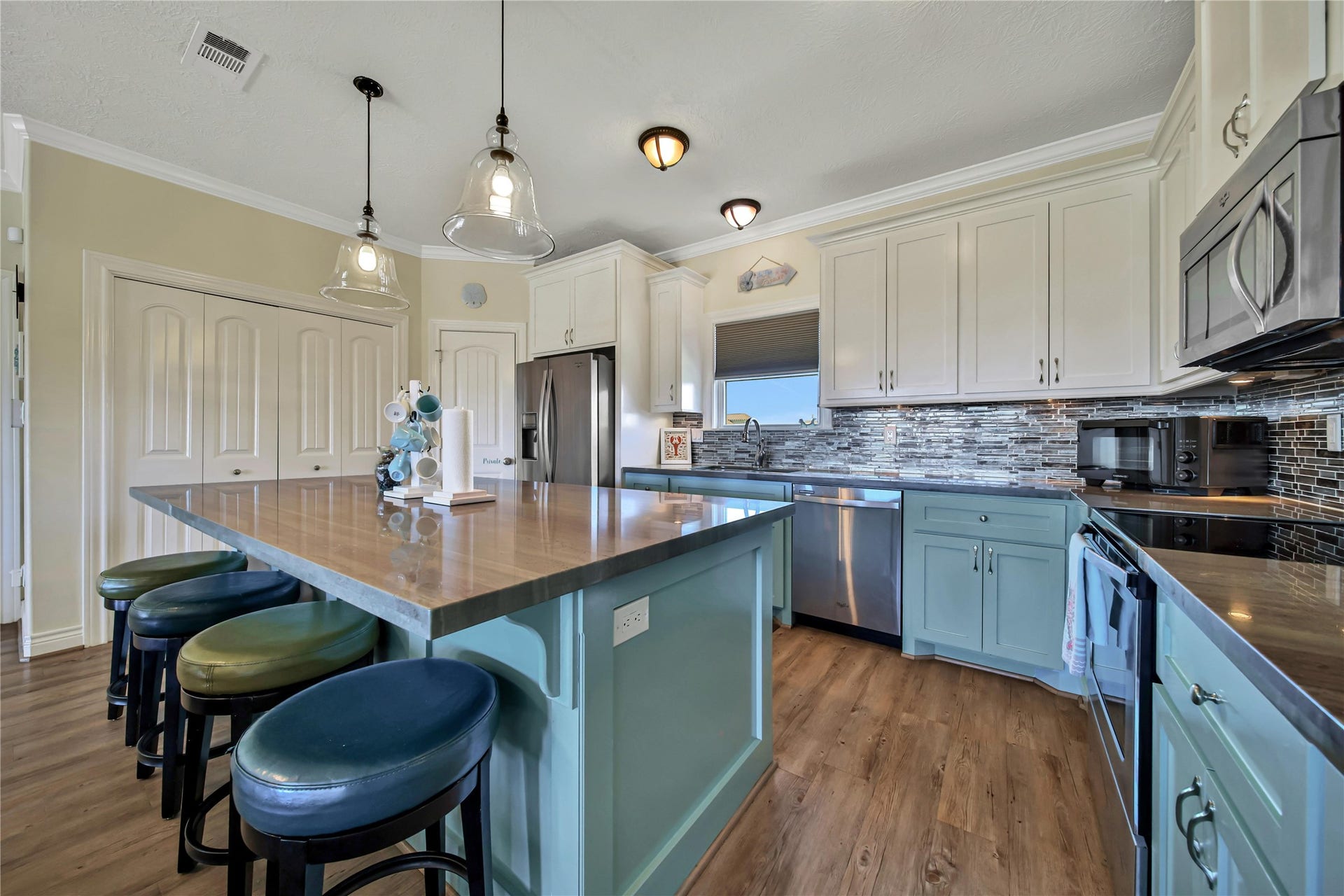 2019 Vista Dr Drive, Crystal Beach, TX 77650 Kitchen features polished concrete countertops & modern appliances.
