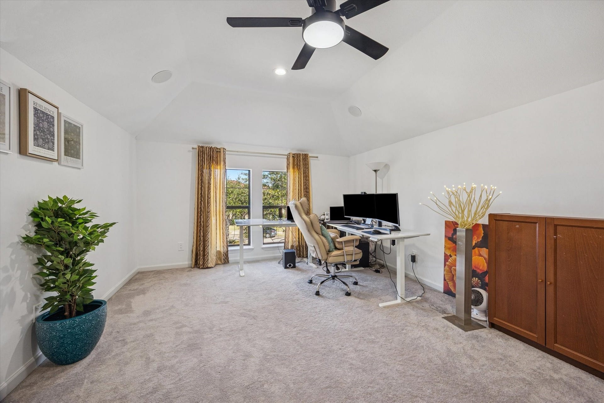 61 Open Sands Court, Sugar Land, TX 77479 This spacious upstairs home office features a vaulted ceiling, ceiling fan, and large window for natural light. ideal for remote work or study. This is one of 2 flex spaces in the home.