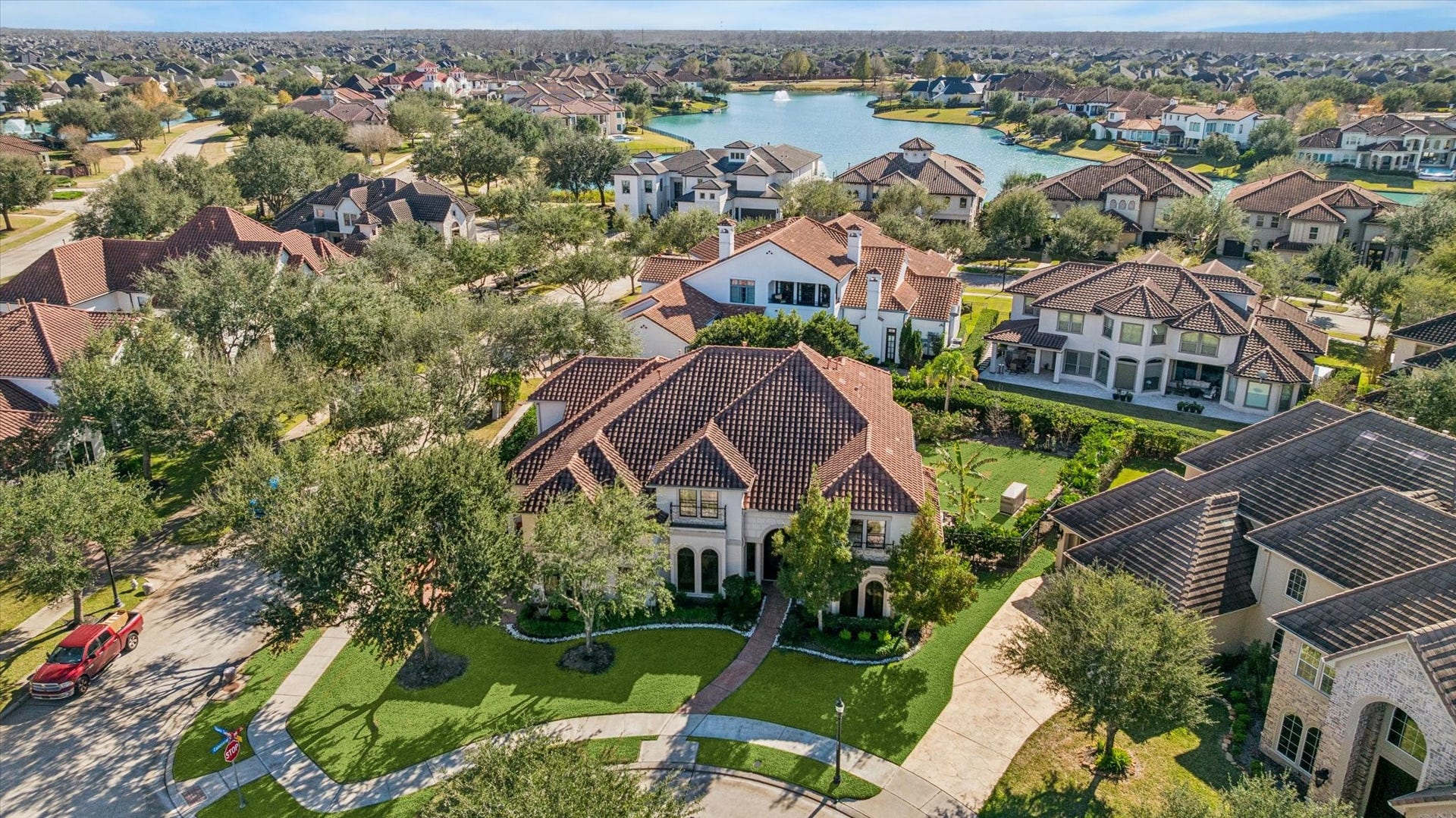 61 Open Sands Court, Sugar Land, TX 77479 This aerial photo showcases the beauty and luxury of Riverstone. Hartford Landing is a gated community with plenty of water views.