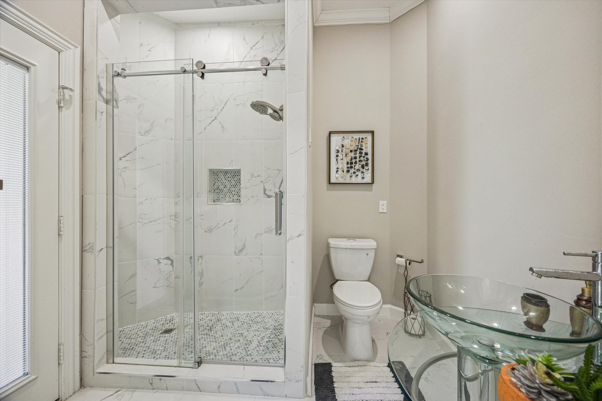61 Open Sands Court, Sugar Land, TX 77479 This is the ensuite 2nd bathroom downstairs with a door leading outside to be used as a pool bath.
