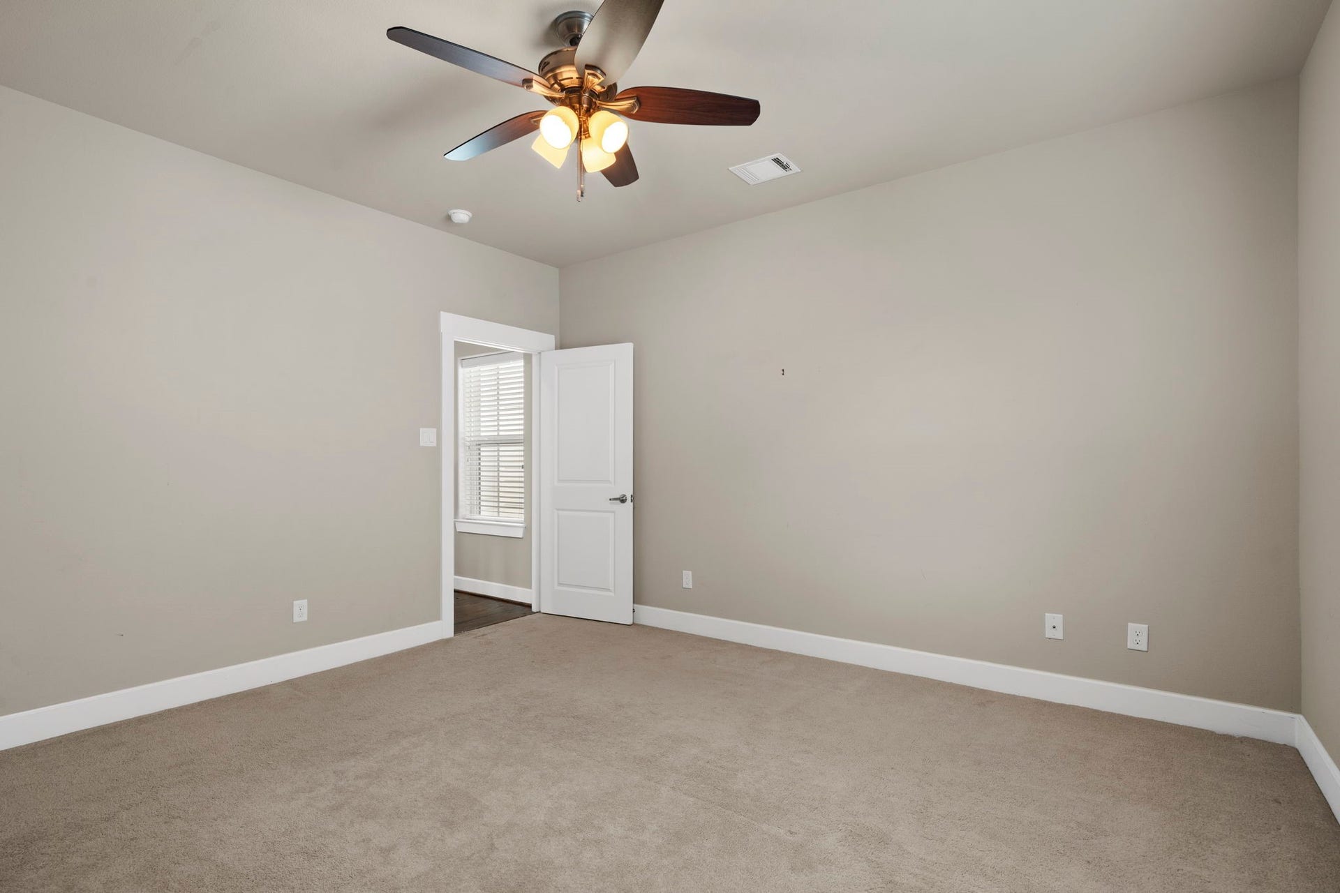 1629 W 23rd Street, Houston, TX 77008 Alternate view of the third-floor secondary bedroom highlighting the comfortable living space.