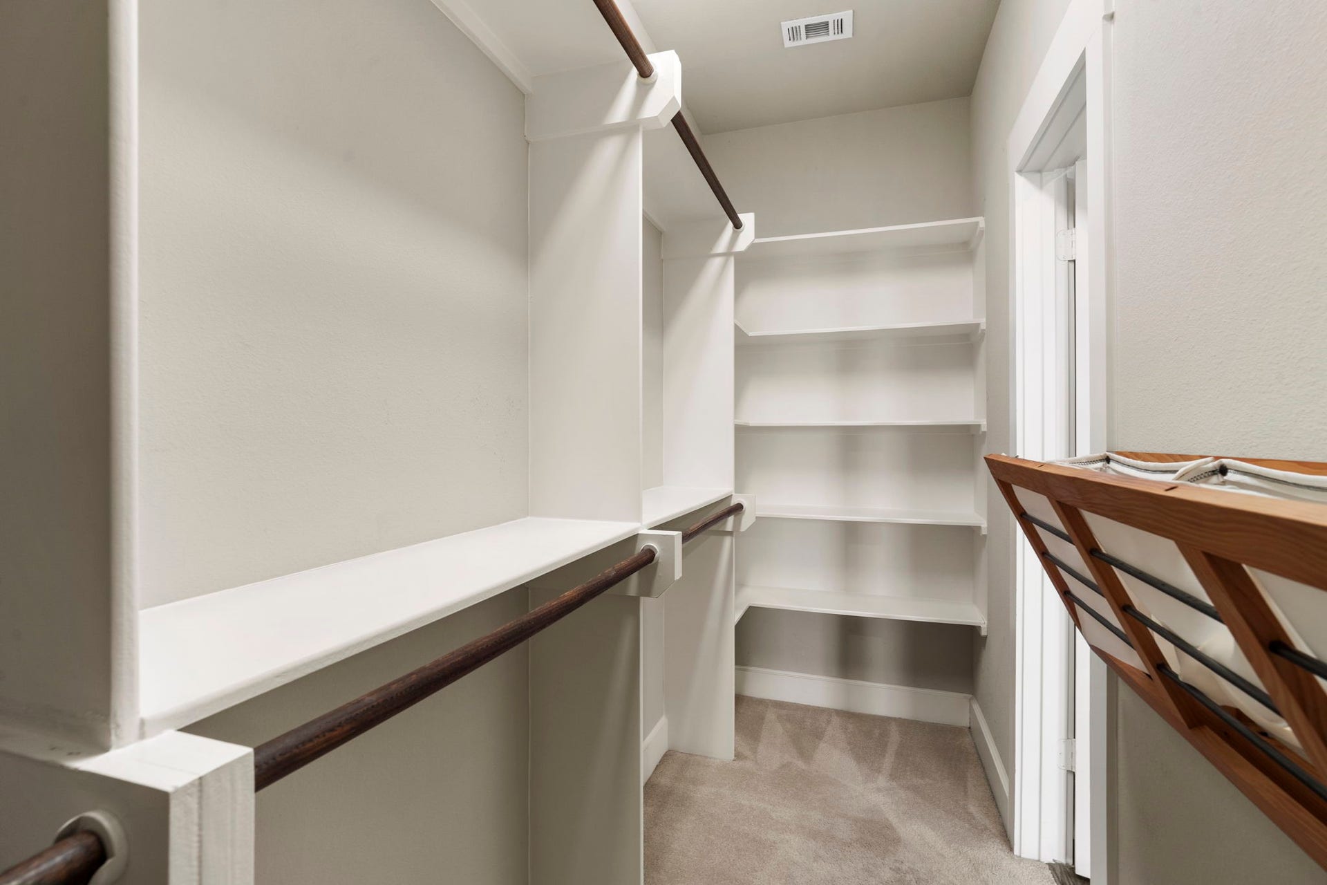 1629 W 23rd Street, Houston, TX 77008 Large walk-in closet featuring dedicated hanging areas and built-in shelving provide ample storage.