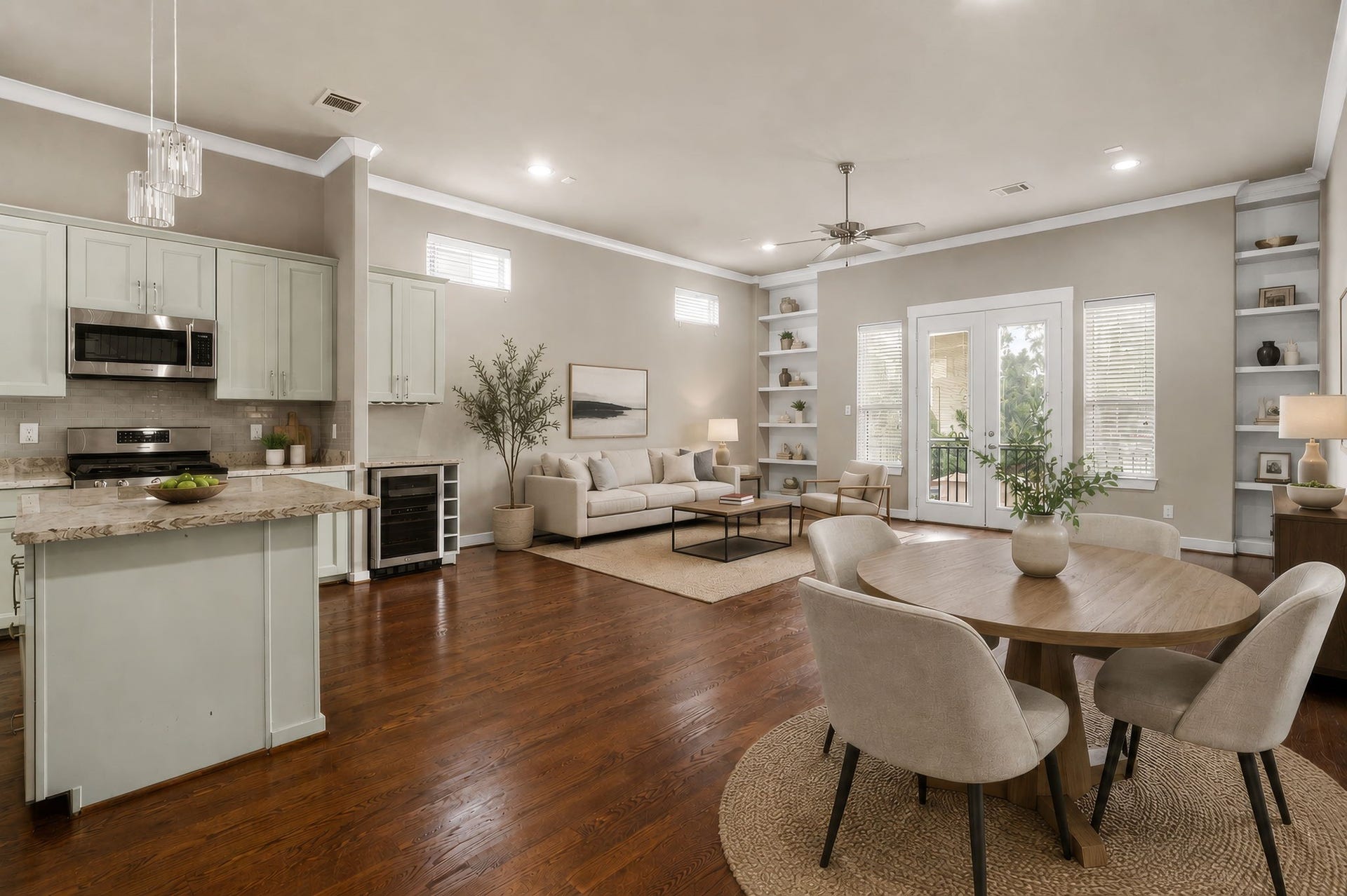 1629 W 23rd Street, Houston, TX 77008 The impressive great room brings together the living area, dining space, and gourmet kitchen in a beautifully connected open-concept design, offering a spacious and inviting setting for everyday living and entertaining. (Digitally staged.)