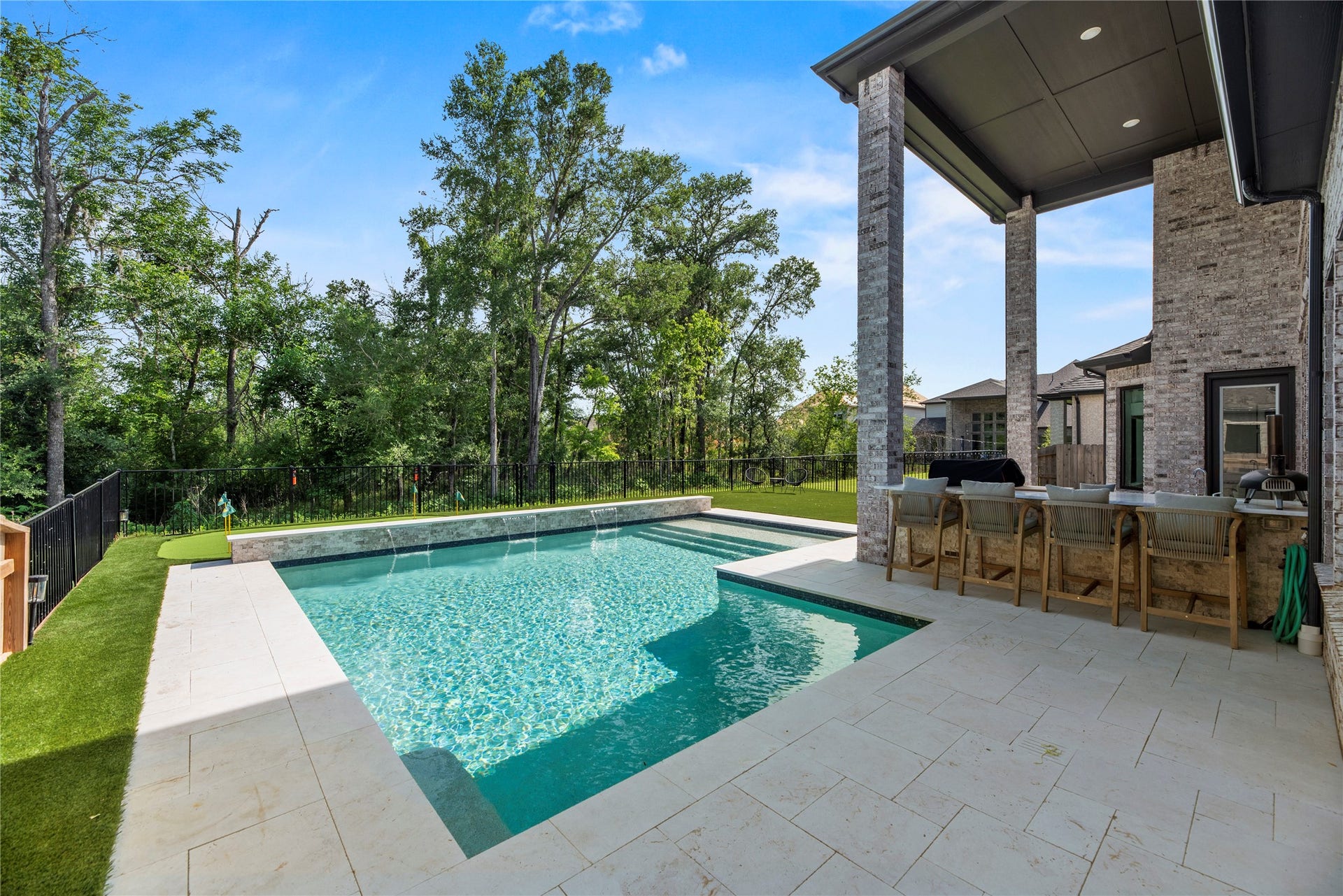4439 Southpoint Way, Fulshear, TX 77441 View of the swimming pool. This property backs up to a green space.