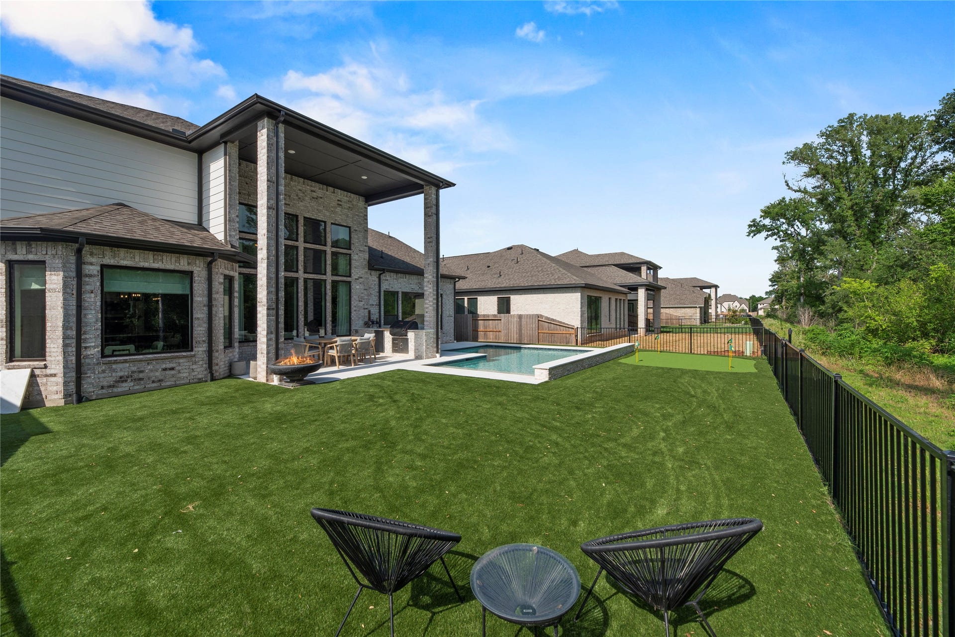 4439 Southpoint Way, Fulshear, TX 77441 View of the back of the house and the backyard.