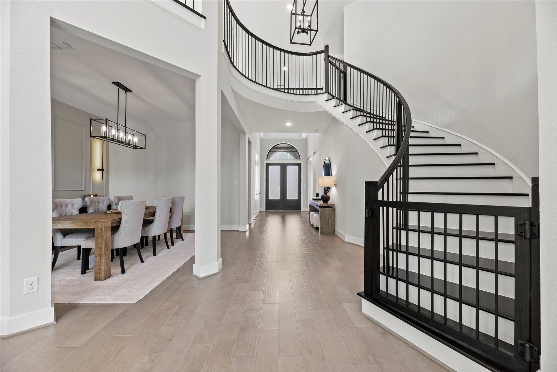 4439 Southpoint Way, Fulshear, TX 77441 View of the entry and the beautiful staircase. Custom built safety gates were added to stairs.