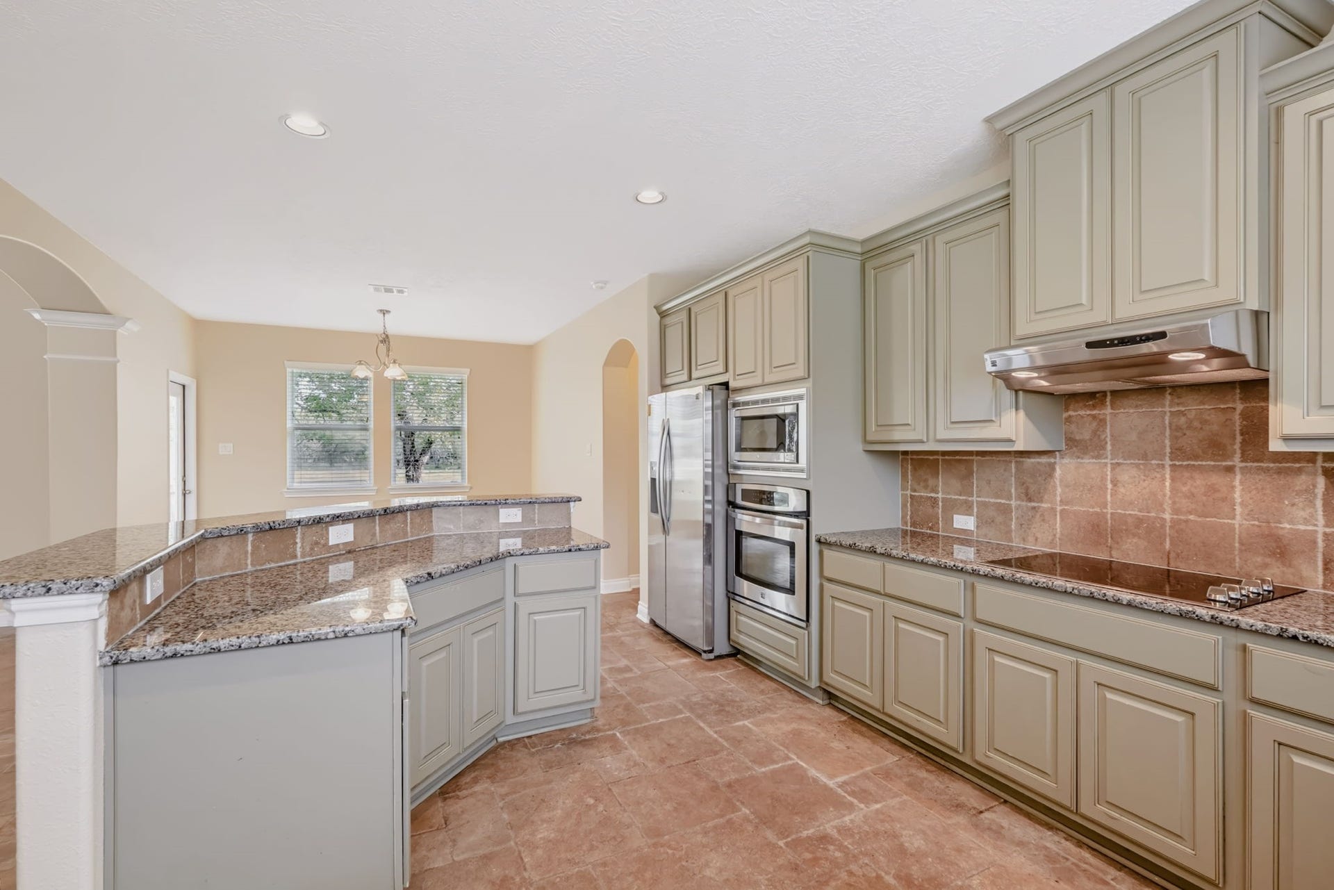 1642 Pultar Road, Richmond, TX 77469 Plenty of room for all the cooks in this kitchen! Stainless steel appliances and soft sage colored cabinetry. Refrigerator stays with the house.