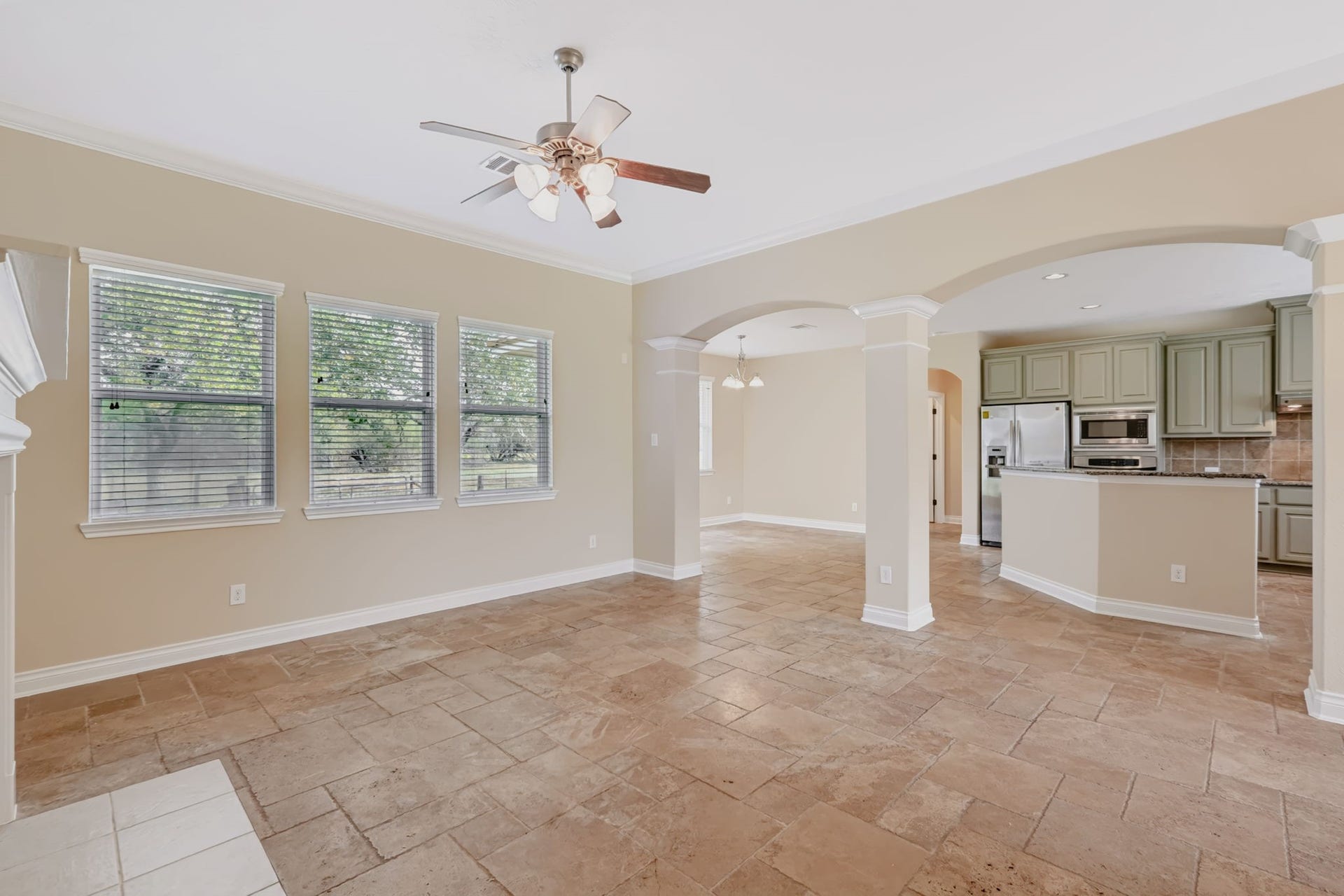 1642 Pultar Road, Richmond, TX 77469 Family room with windows overlooking the back of the home. Notice the crown molding!