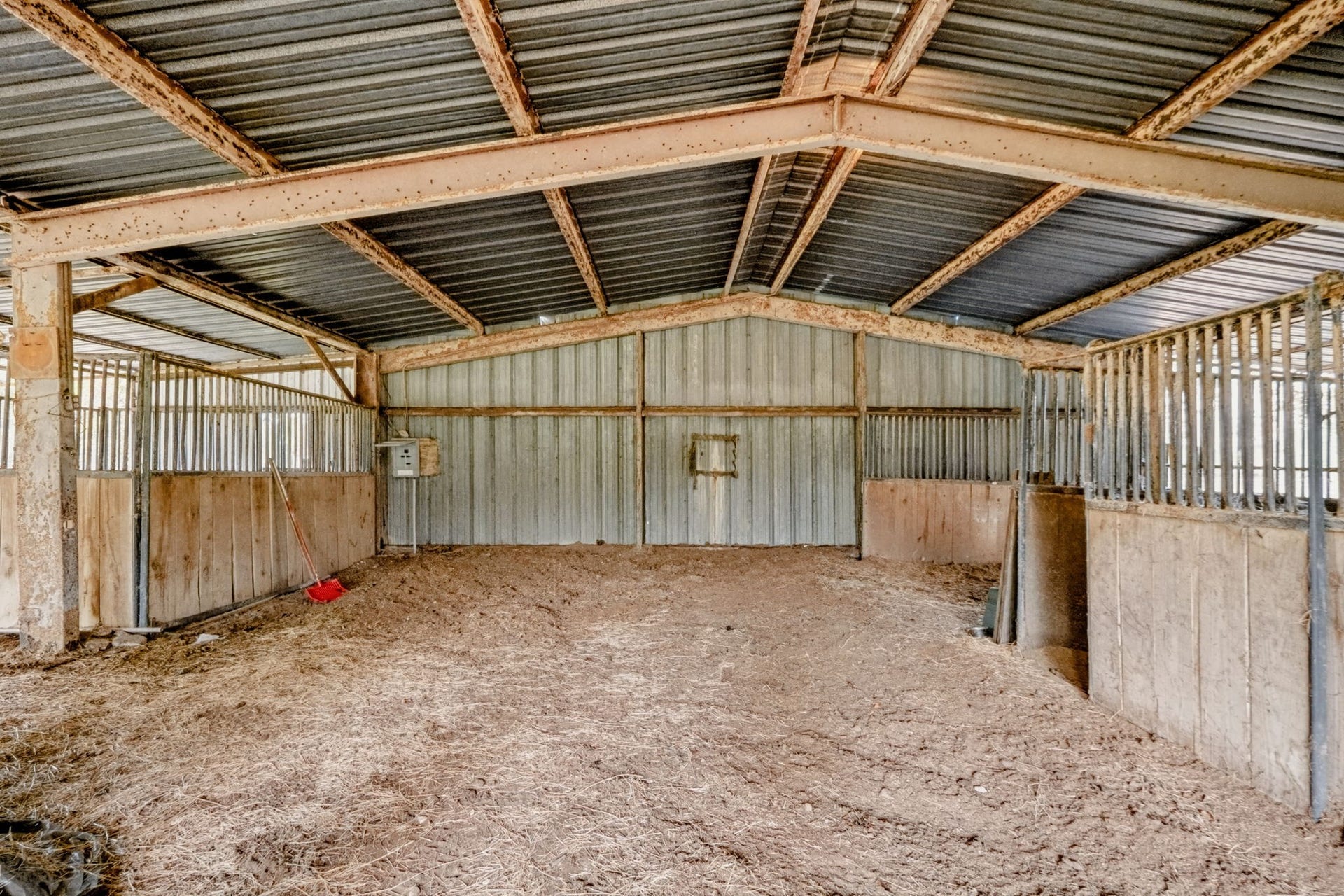 1642 Pultar Road, Richmond, TX 77469 Two of the 12'x12' stalls plus the space where the fourth stall could be added at the back. Barn has water and electricity.