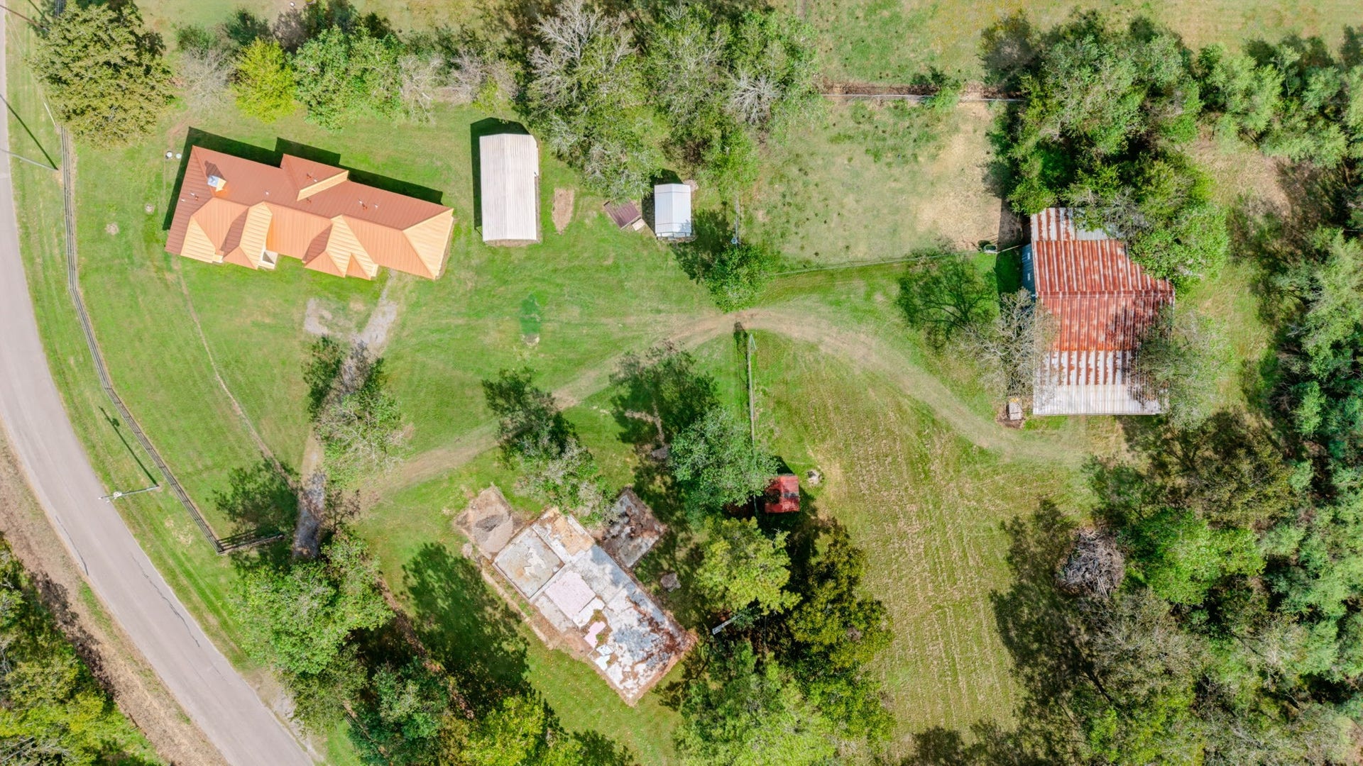 1642 Pultar Road, Richmond, TX 77469 Great view of the house, carport, storage shed, barn and old foundation.