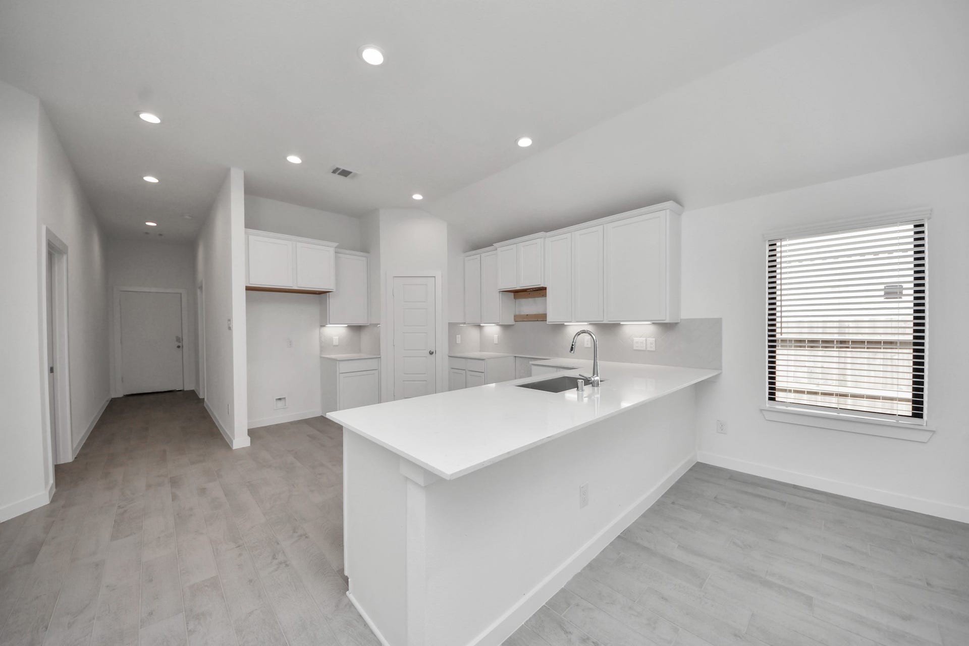3068 Spoolwood Trail, Magnolia, TX 77355 The extended counter area adds both practicality and style, making meal preparation a breeze. Every detail is thoughtfully designed to enhance the kitchen's functionality and aesthetic appeal.