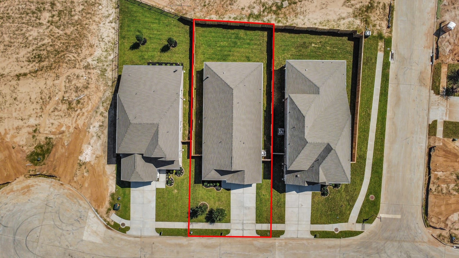 3068 Spoolwood Trail, Magnolia, TX 77355 An aerial view of a spacious subdivision lot, highlighting a well-maintained yard and a fully fenced perimeter, offering both privacy and expansive outdoor space.