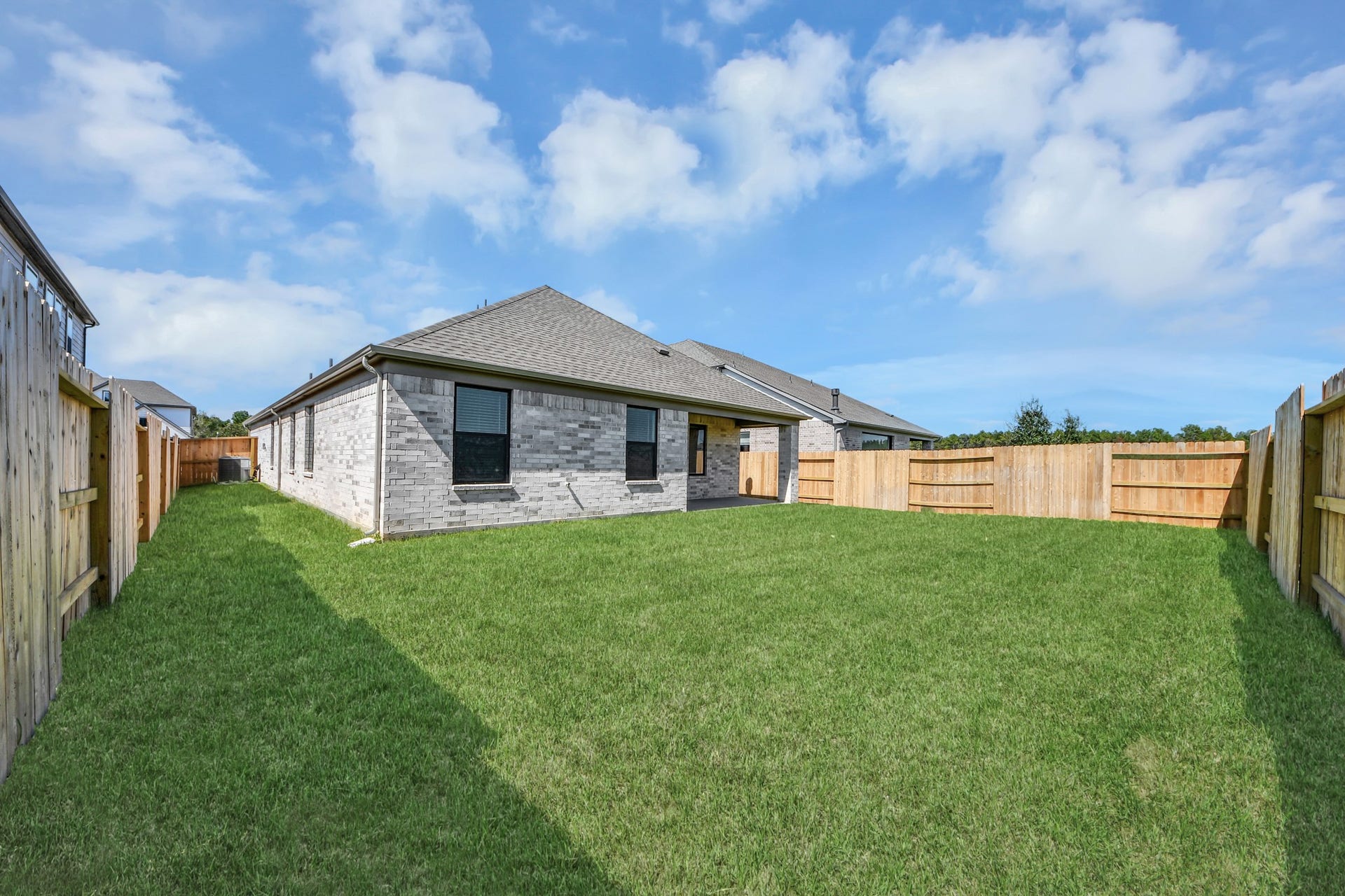 3068 Spoolwood Trail, Magnolia, TX 77355 Experience outdoor living at its finest on this expansive covered patio, thoughtfully designed for BBQs and delightful outdoor dining.