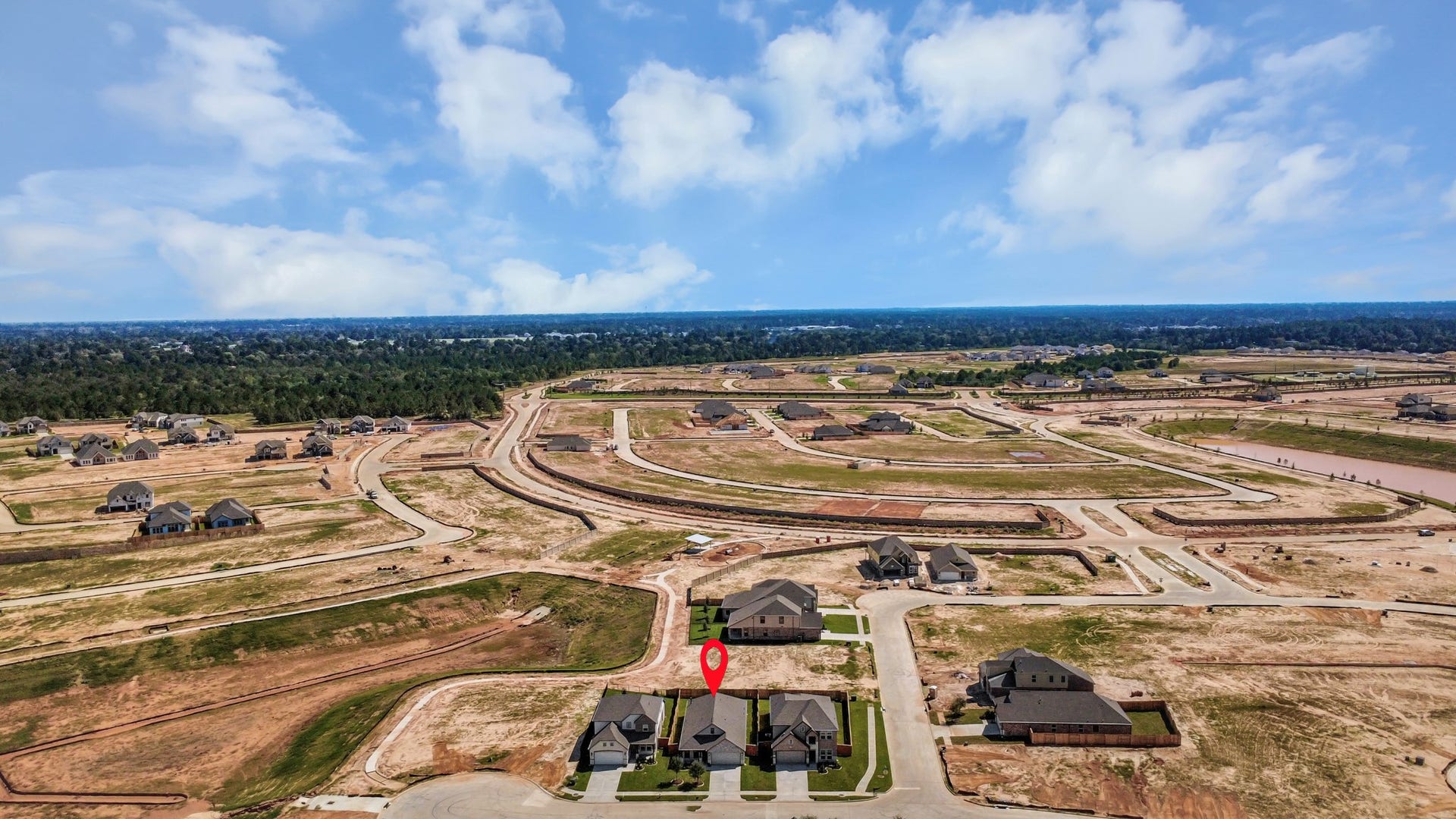 3068 Spoolwood Trail, Magnolia, TX 77355 An aerial view of a spacious subdivision lot, highlighting a well-maintained yard and a fully fenced perimeter, offering both privacy and expansive outdoor space.