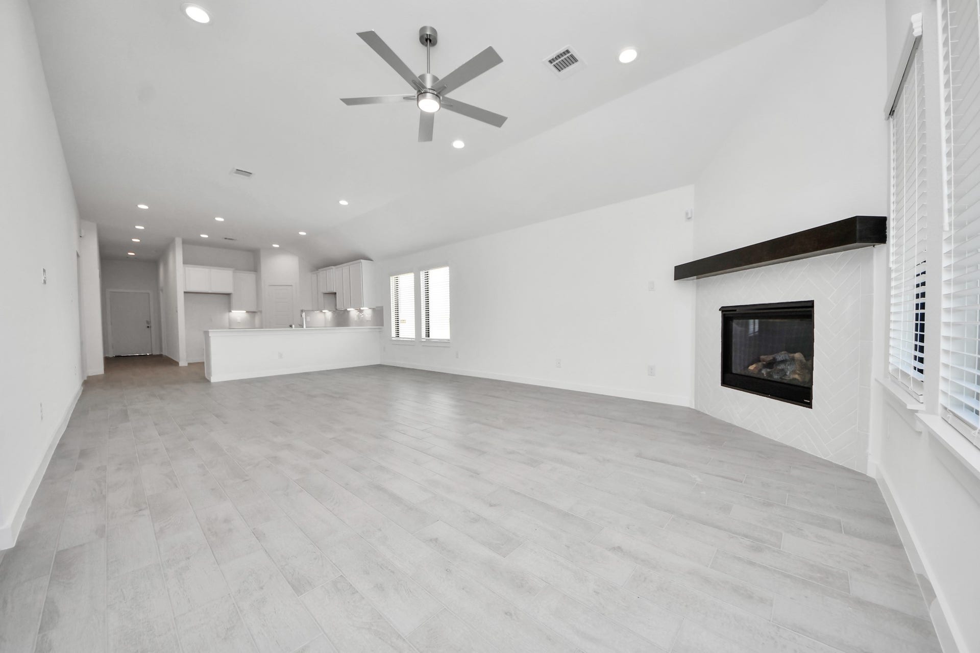 3068 Spoolwood Trail, Magnolia, TX 77355 Gather the family and guests together in your lovely living room! Featuring soaring high ceilings, recessed lighting, ceiling fan, custom paint, gorgeous floors, and large windows that provide plenty of natural lighting throughout the day.
