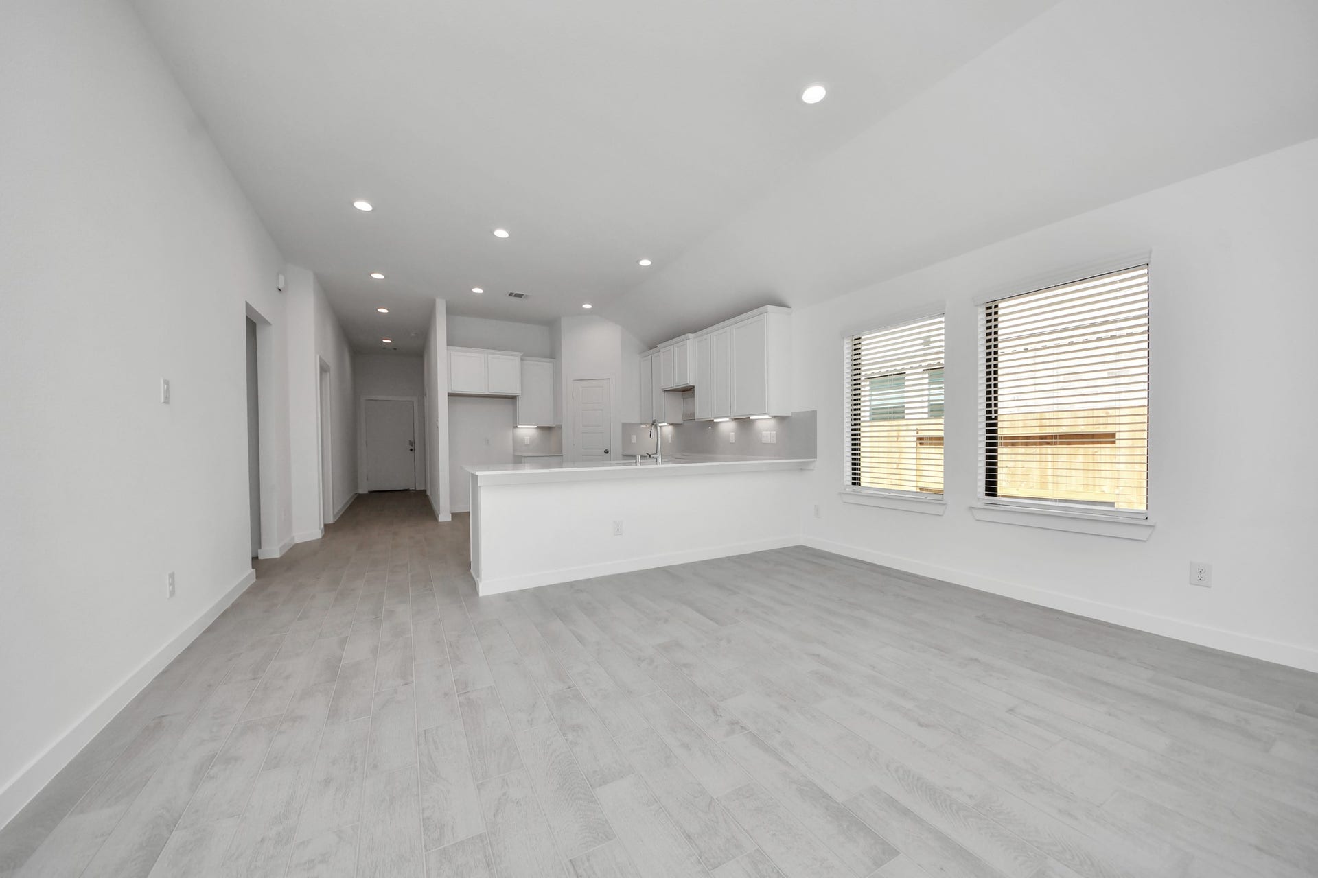 3068 Spoolwood Trail, Magnolia, TX 77355 Take another glimpse into the heart of the home with this additional view of the family rooma sprawling space ready to accommodate all your gatherings.