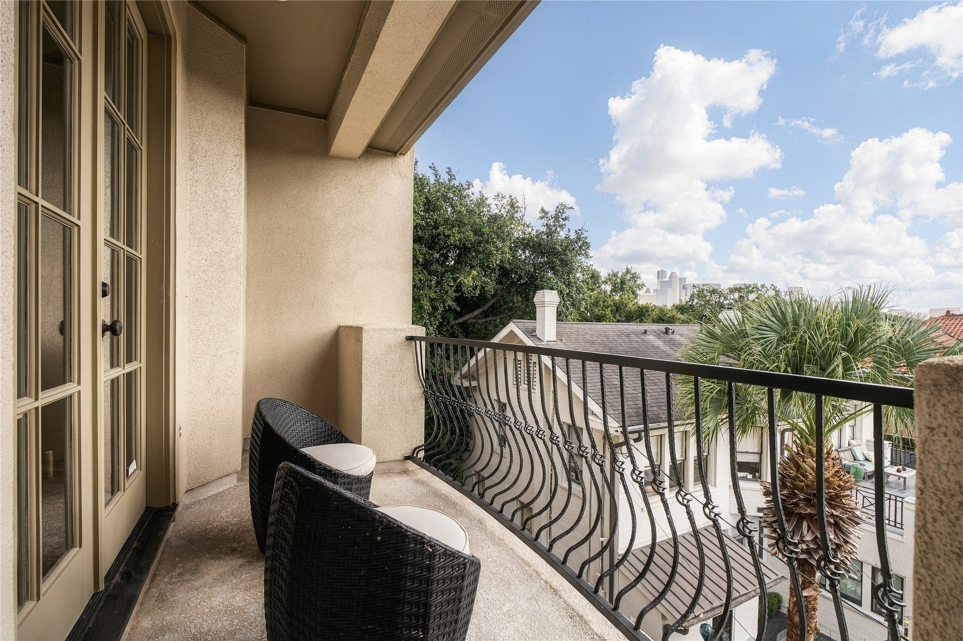 523 Lovett Boulevard, Houston, TX 77006 Step outside the primary to a private balcony with a direct sightline toward Downtown Houston, an easy spot for morning coffee or winding down at the end of the day.