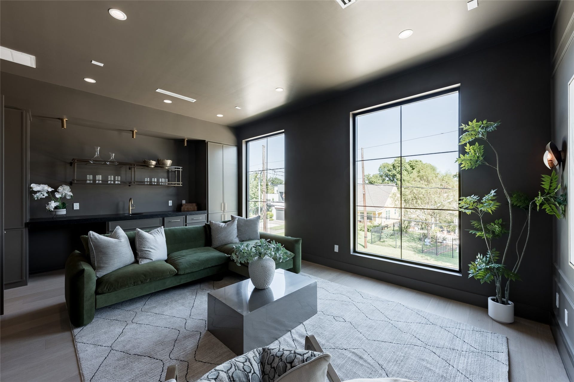 1109 Voight Street, Houston, TX 77009 The dedicated media room sets a mood of its own, with darker finishes, generous proportions and large windows creating a comfortable retreat for movie nights and entertaining.