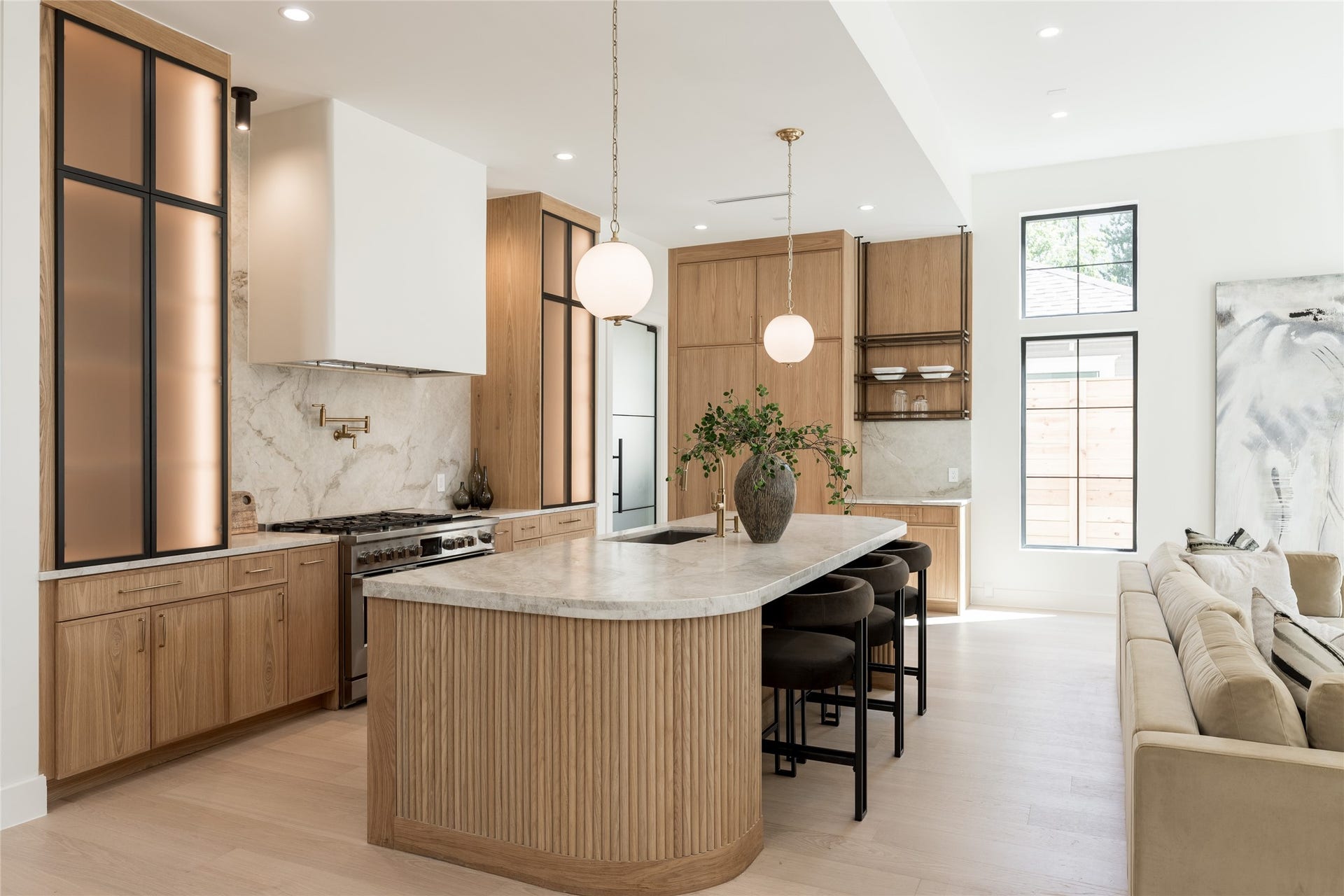 1109 Voight Street, Houston, TX 77009 The oversized island anchors the kitchen with generous prep and gathering space, while the full butlers pantry sits discreetly beyond, keeping additional prep, storage and cleanup out of the main view.