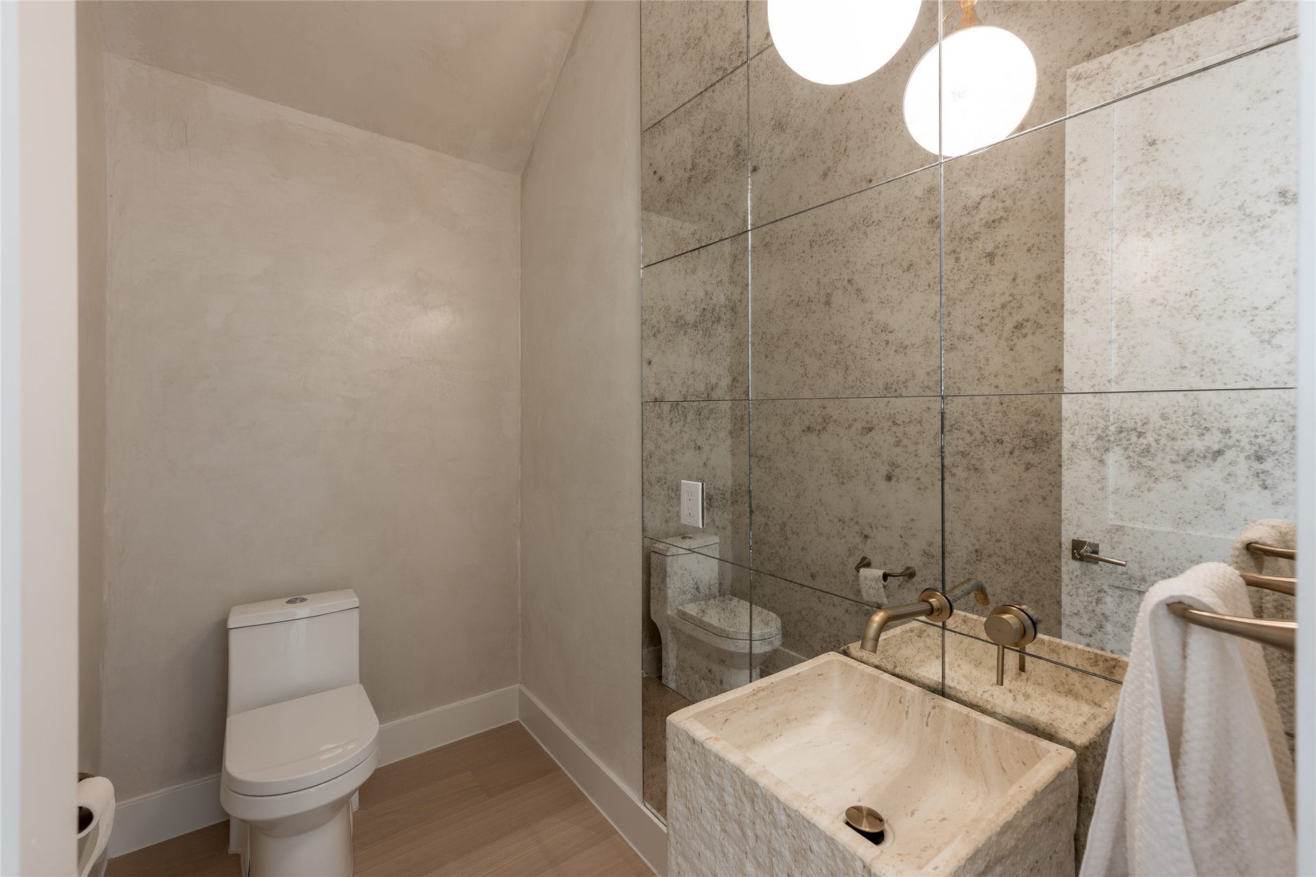 1109 Voight Street, Houston, TX 77009 Antique mirror brings depth and character to the powder room along with plastered walls for an elevated feel.