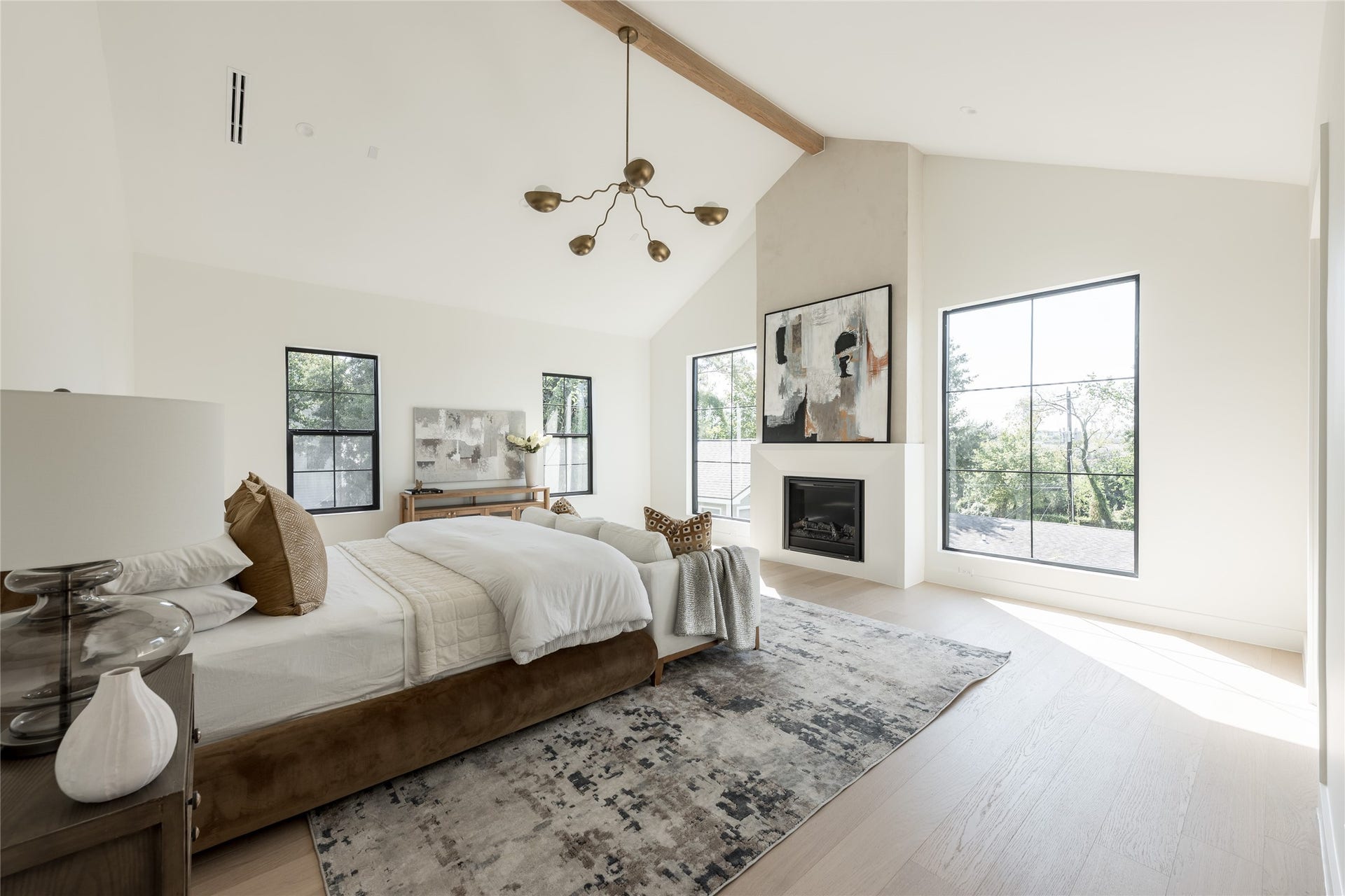 1109 Voight Street, Houston, TX 77009 A second perspective reveals the true scale of the primary suite, where the cathedral ceiling, fireplace and dedicated sitting area give the room the feel of a private residence within the home.