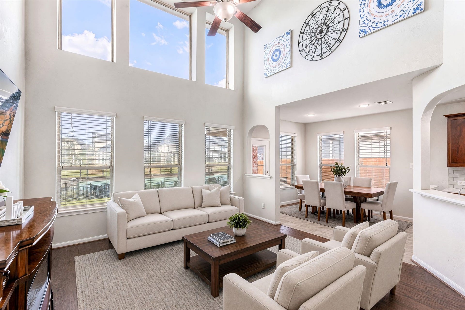 24030 Cannon Anello Court, Katy, TX 77493 Virtually Staged Living Room. The large windows awash the main living areas with natural light.