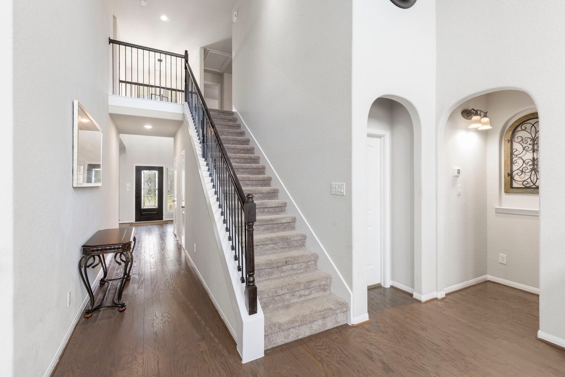 24030 Cannon Anello Court, Katy, TX 77493 To the right of the living room is the primary suite and utility room.