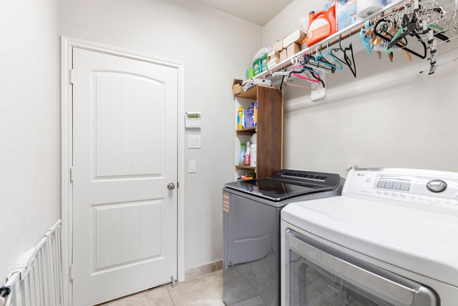 24030 Cannon Anello Court, Katy, TX 77493 The utility room is equipped with additional storage. Not shown is the storage from under the stairs.