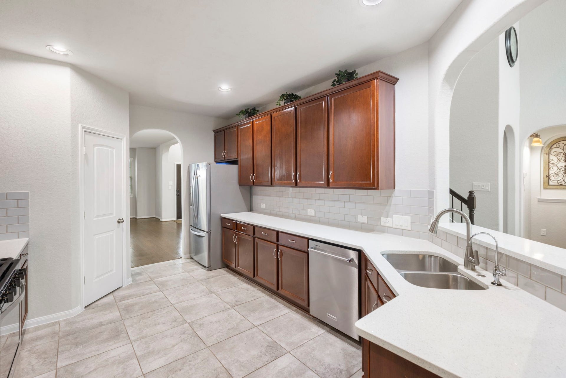 24030 Cannon Anello Court, Katy, TX 77493 The kitchen offers ample amounts of countertop and cabinet space for cooking and storage.