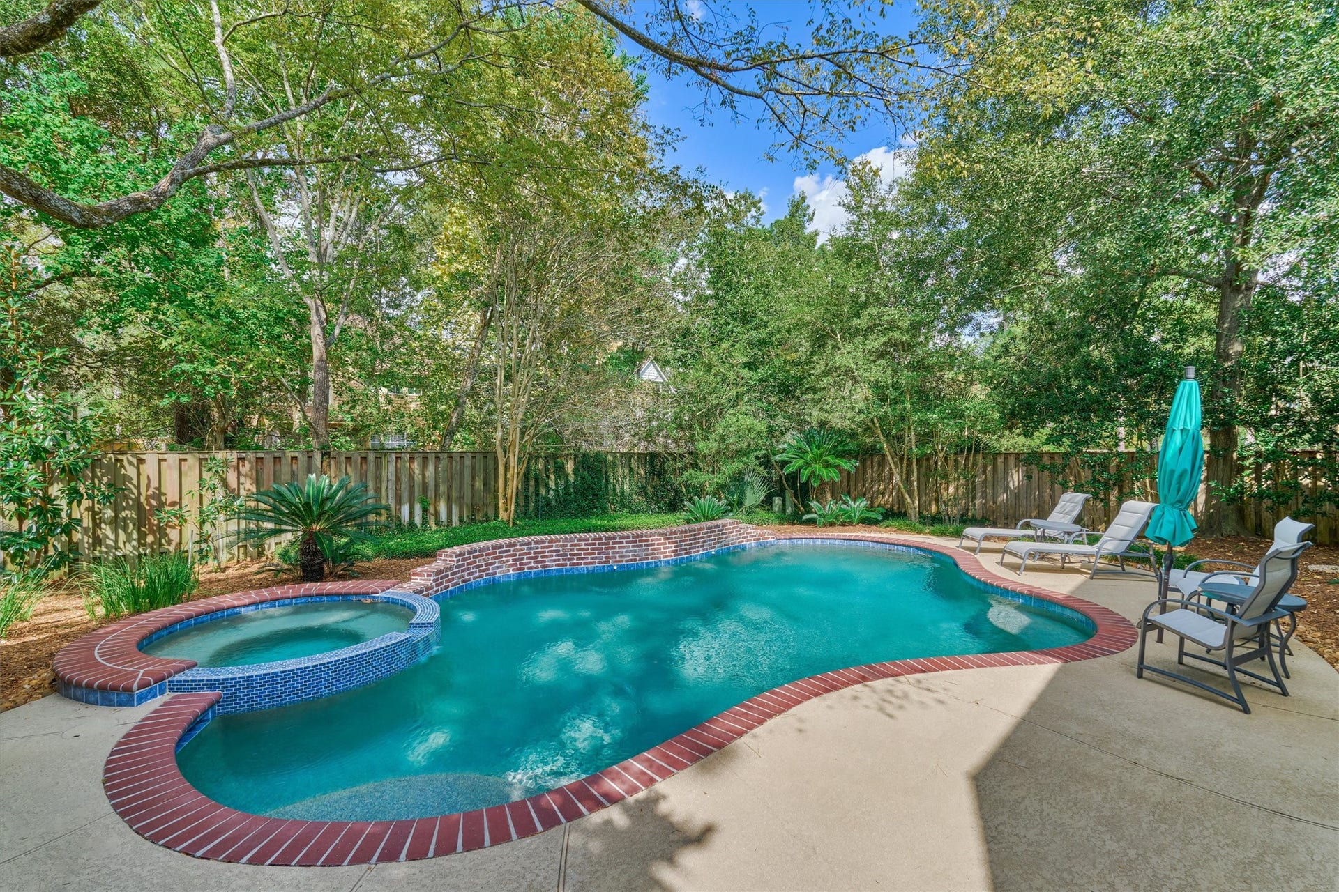 Welcome to your own slice of paradise with a buffer easement behind the property for extra privacy *and* a fresh pool renovation in '20!