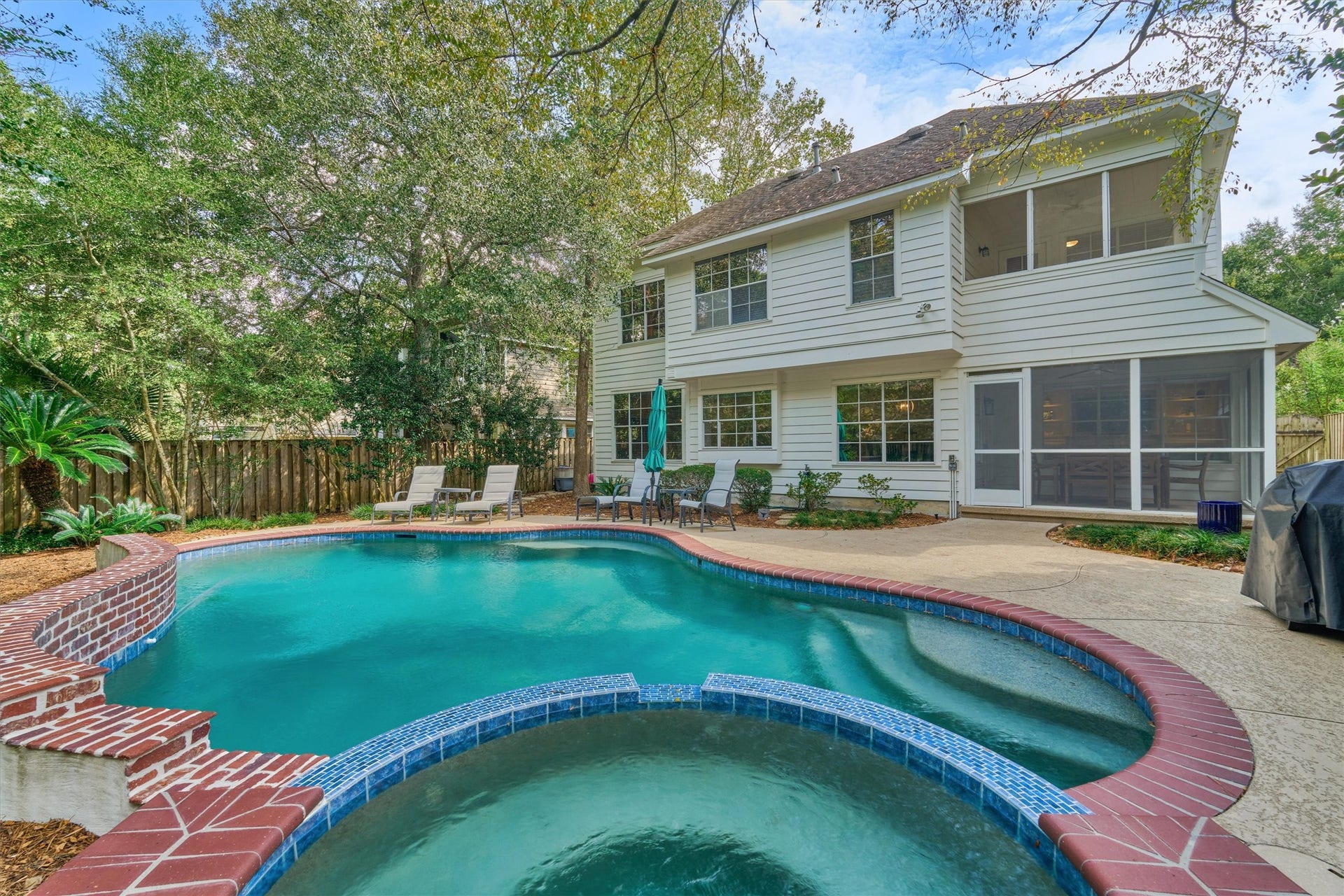Expansive decking surrounds the pool, offering plenty of space for your favorite patio furniture and poolside lounging!