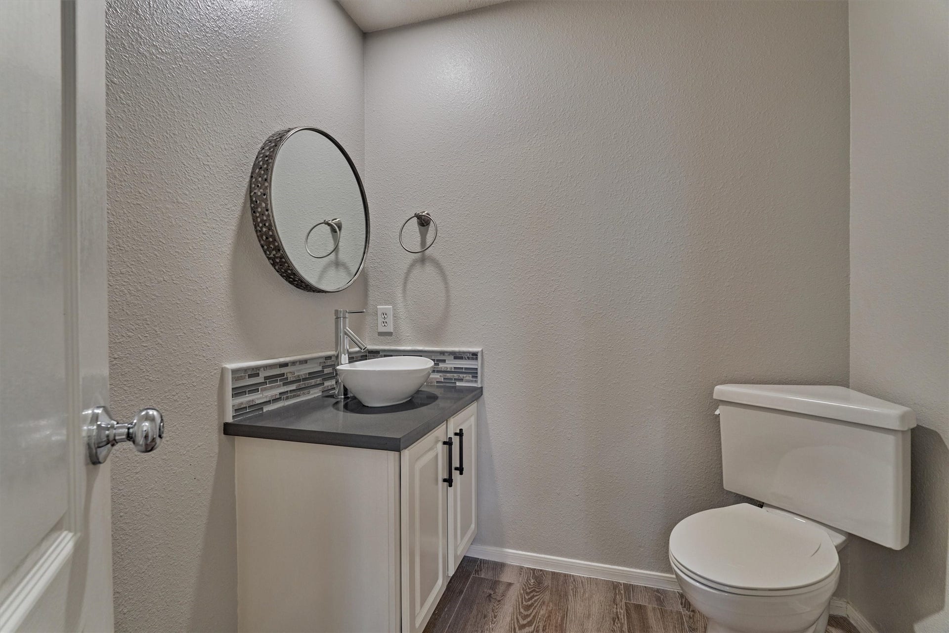 Conveniently located downstairs half bath offers added comfort and convenience for guests!