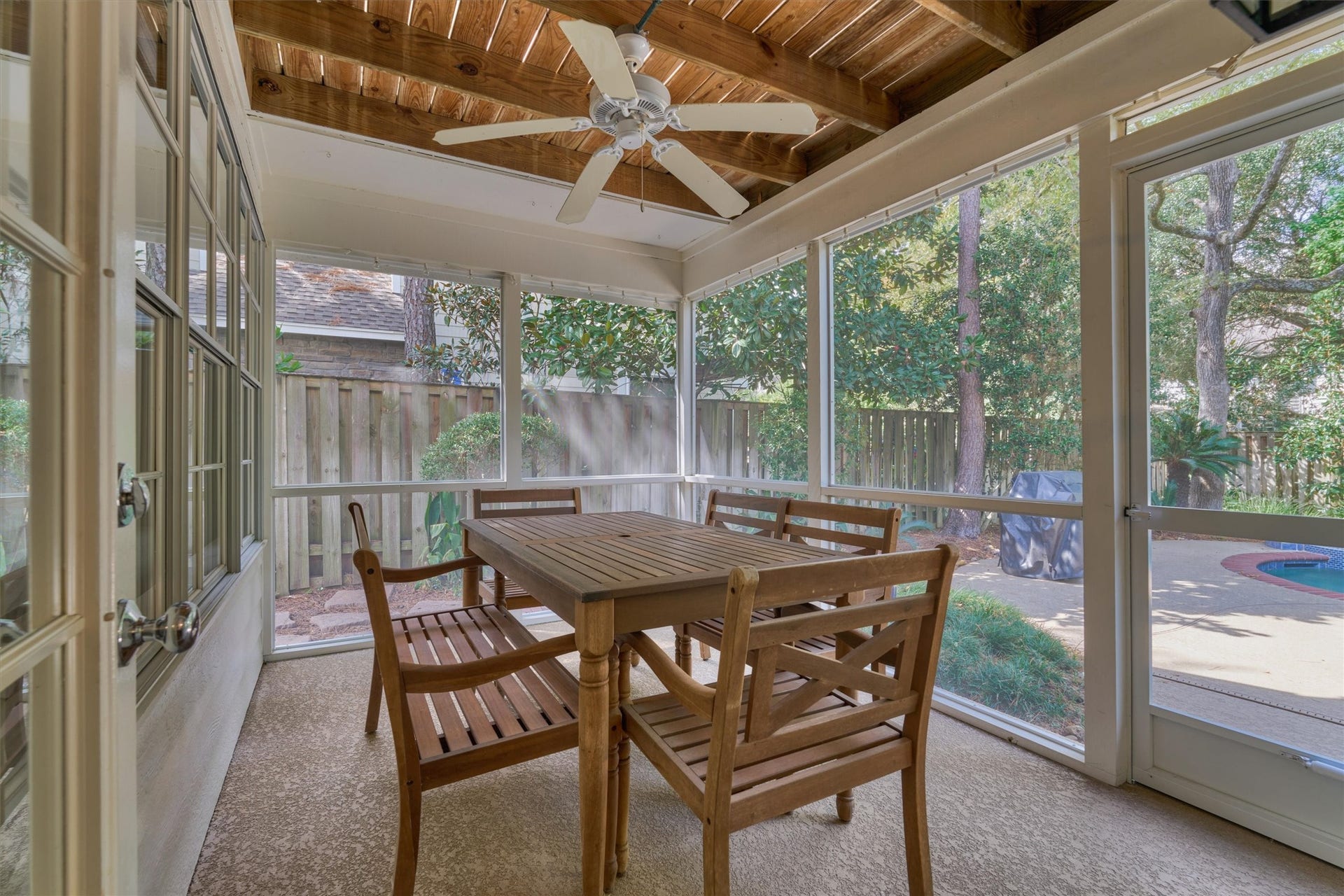 Enjoy peaceful mornings and relaxing evenings on the screened-in patio, complete with a ceiling fan and captivating views of your water + landscape!