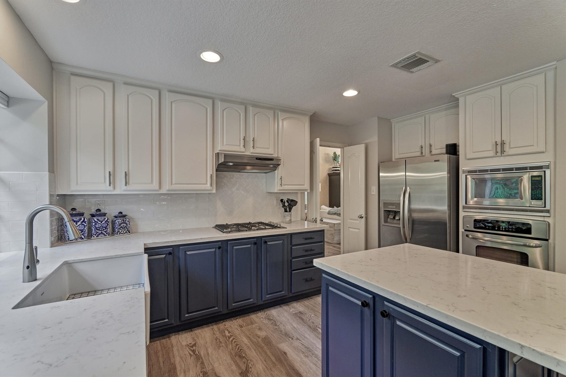 Enjoy everyday living and entertaining with ease in the kitchen with easy flow to the dining room/living room, den breakfast room, and screened-in patio --- so ideal!