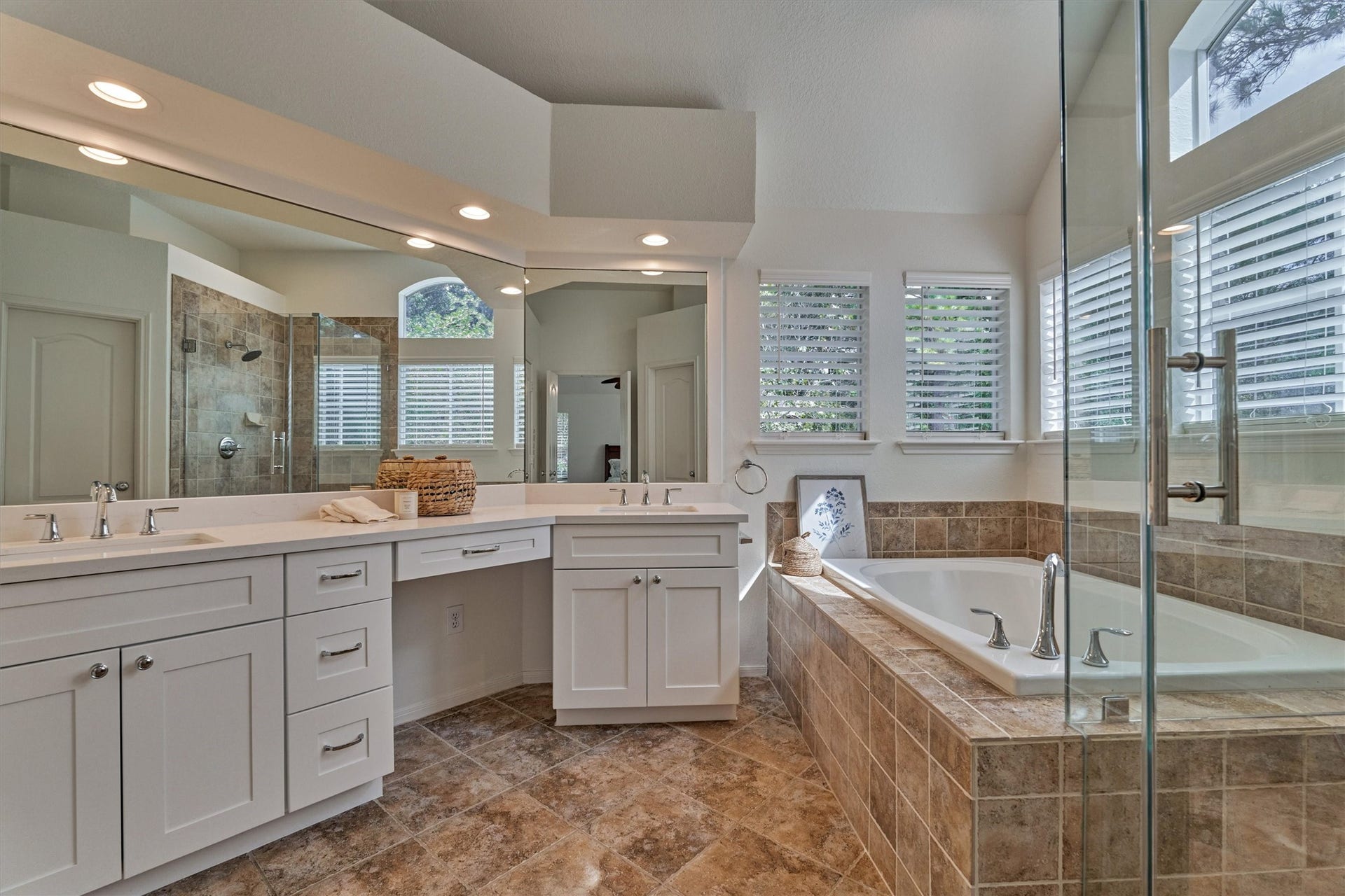 Spa-like bathroom is bathed in natural light and features all the thoughtful amenities you need for everyday comfort and relaxation!