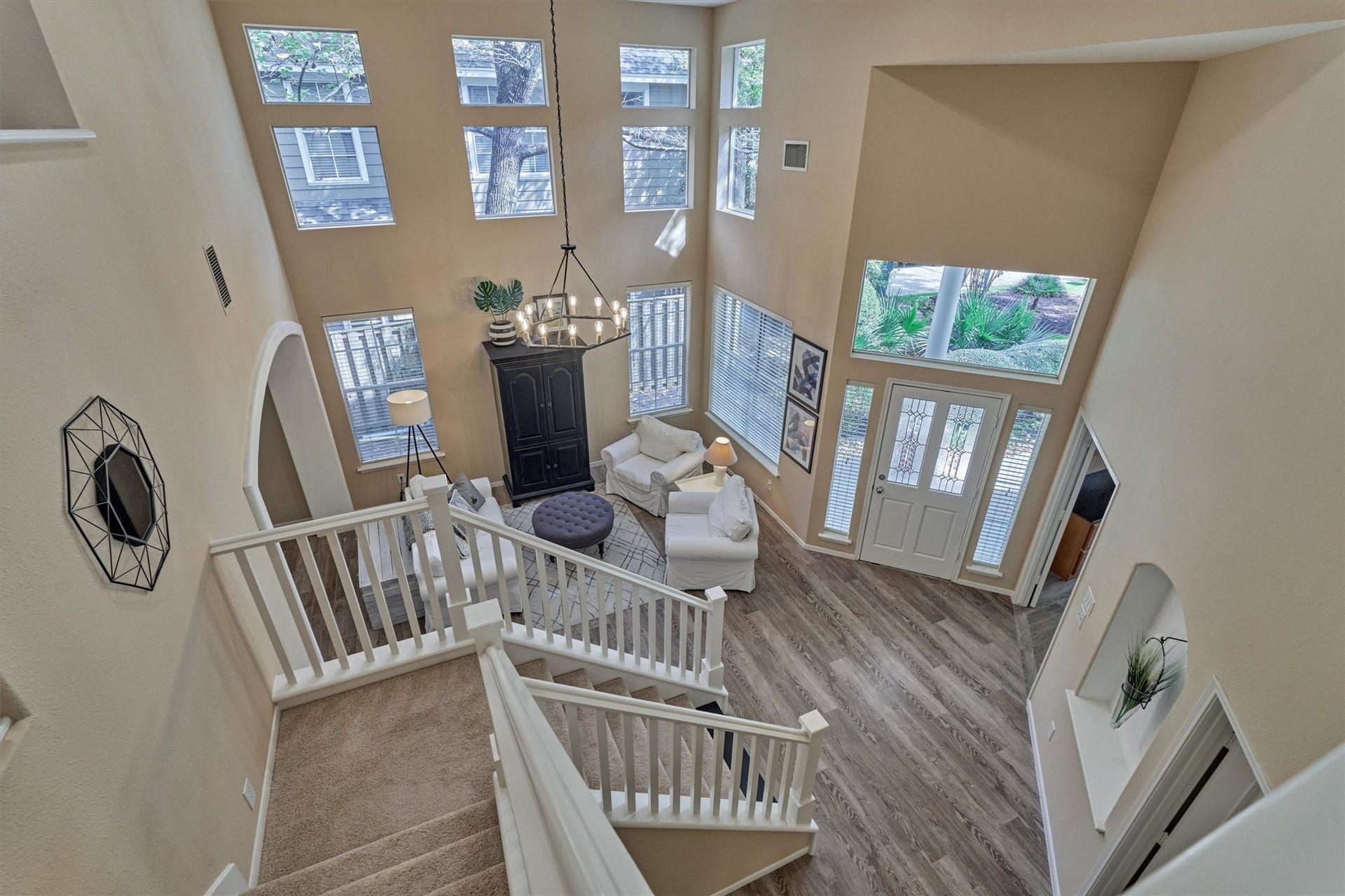 Enjoy stunning views of the grand two-story entryway and living room from the second-floor landing! NEW CARPET!