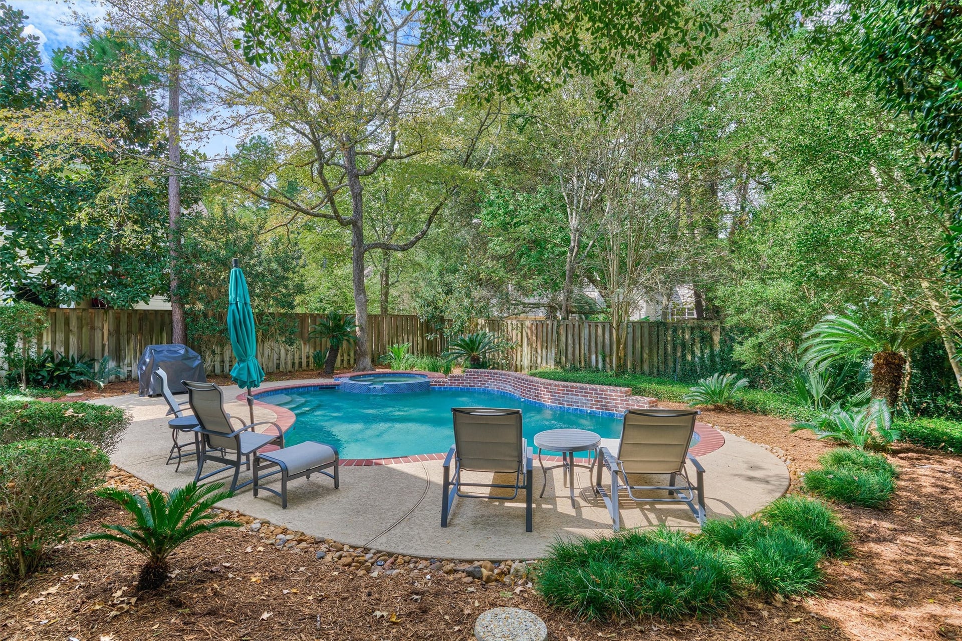 A tree-lined backyard retreat is priceless! Enjoy the picturesque pool & spa, surrounded by lush, mature landscaping that insulates your outdoor living area!