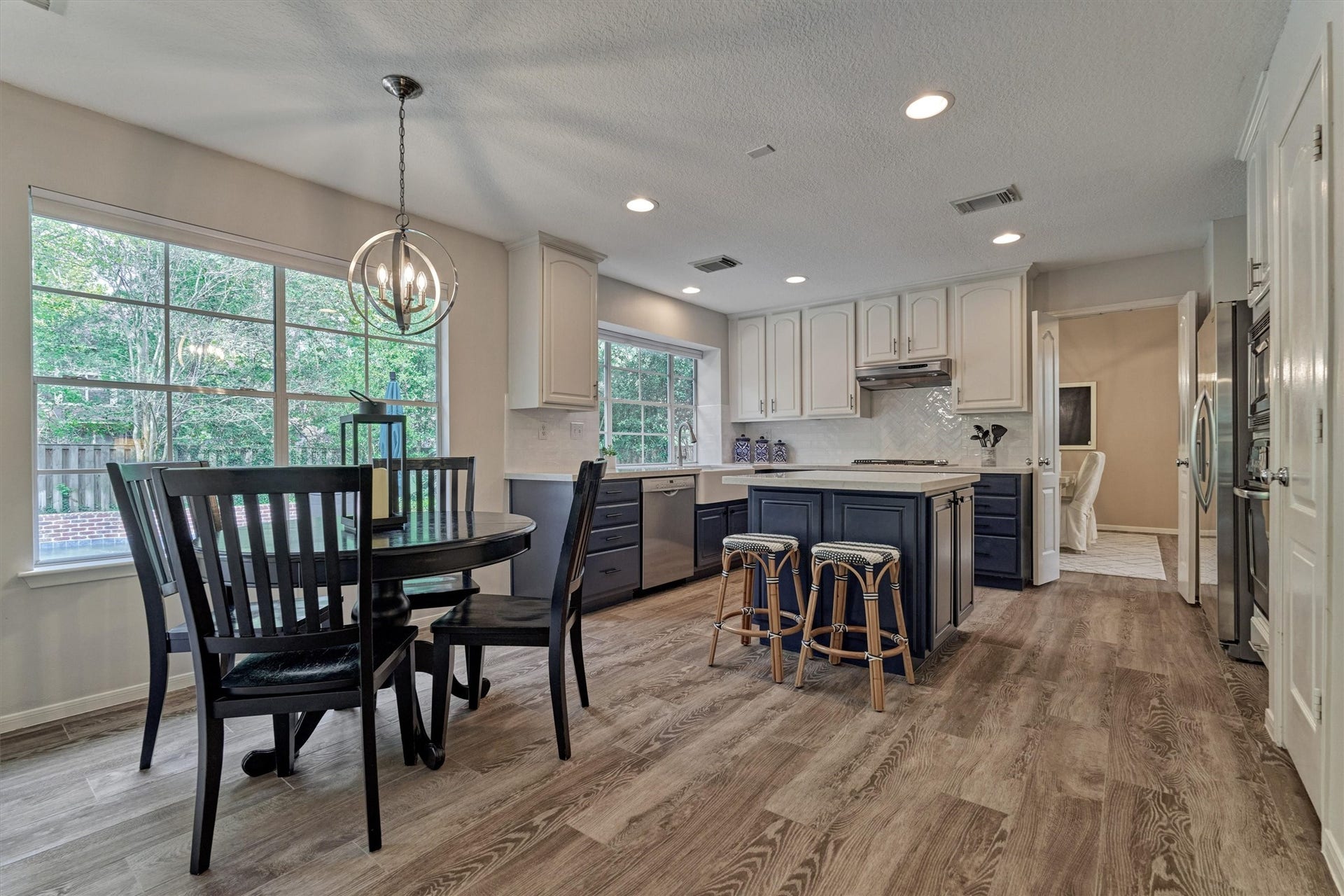 You'll love the seamless flow and thoughtful functionality between the kitchen and surrounding living spaces, ideal for both everyday living and entertaining!