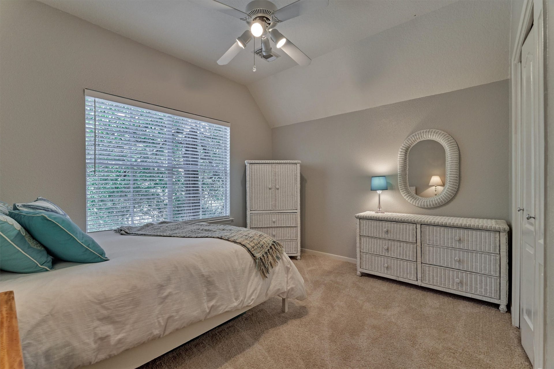 Secondary bedroom #3 features fresh carpeting, a ceiling fan, and a closet, offering a comfortable and inviting space!