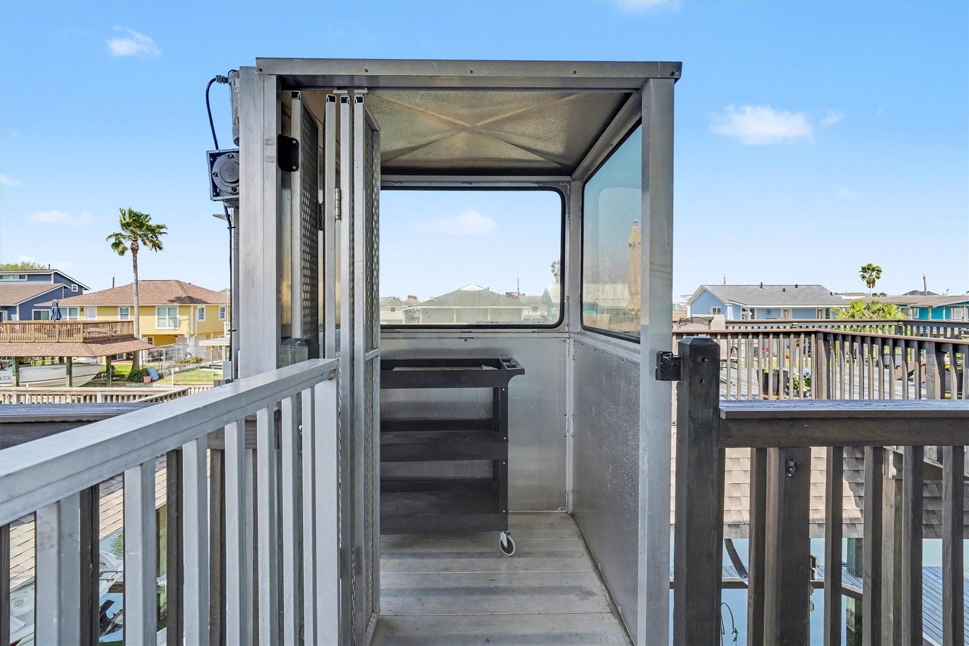437 Pompano Street, Bayou Vista, TX 77563 Enclosed cargo lift adds everyday ease and convenience, making trips upstairs effortless. Whether carrying groceries on a rainy day or hauling supplies, this thoughtful feature keeps life simple and dry