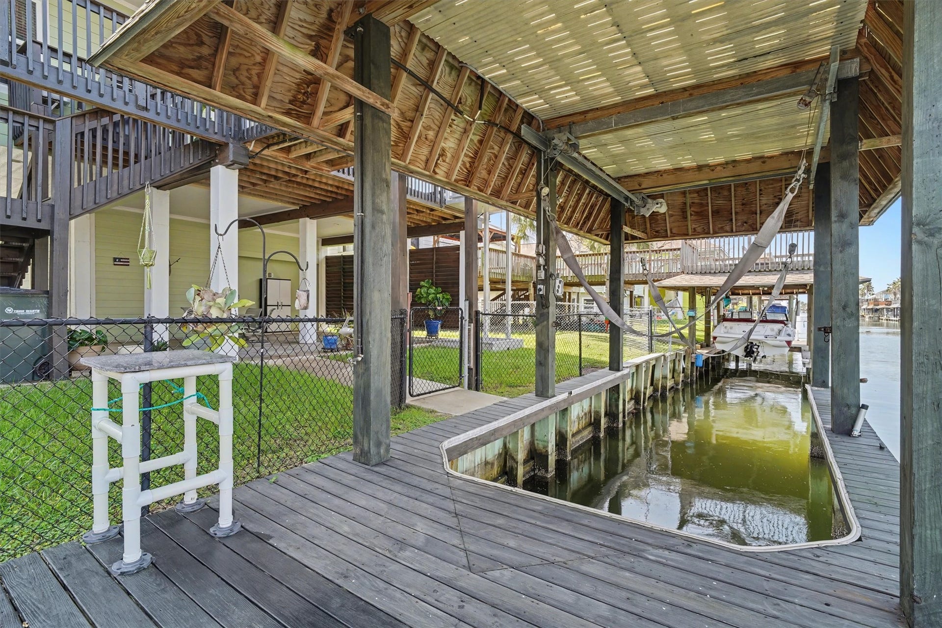 437 Pompano Street, Bayou Vista, TX 77563 Waterfront paradise with a private boat slip and spacious dockperfect for fishing, crabbing, swimming, or simply relaxing by the water. Thoughtfully designed with a convenient fish cleaning station and secure fencing along the waters edge, offering peace of mind for kids and pups alike