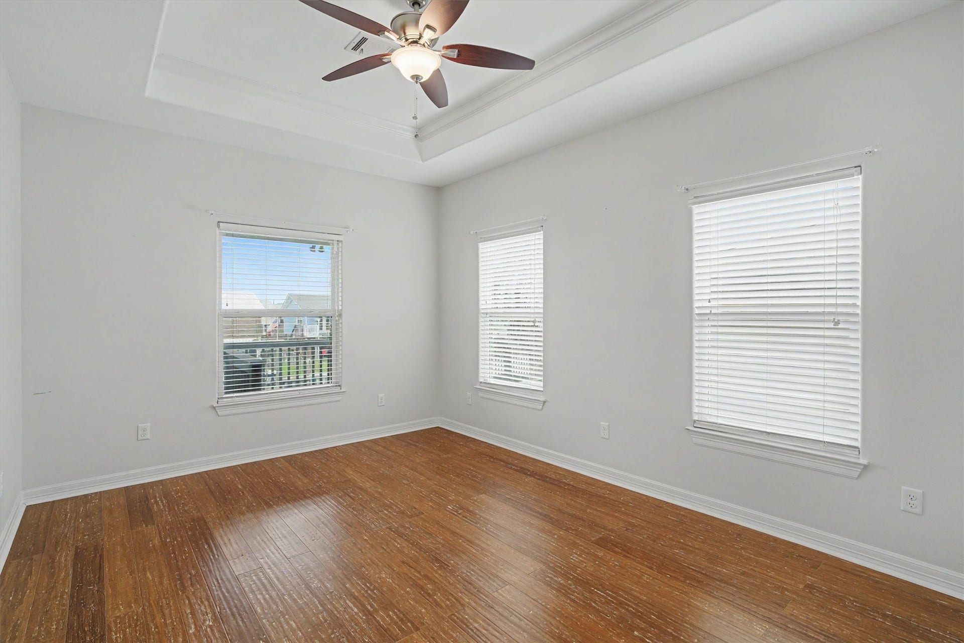 437 Pompano Street, Bayou Vista, TX 77563 The primary bedroom, where tranquility meets breathtaking beauty. This spacious retreat offers ample room for all your furnishings, creating a harmonious blend of comfort and style. Wake up to the gentle embrace of natural light streaming through expansive windows, providing uninterrupted views of the water